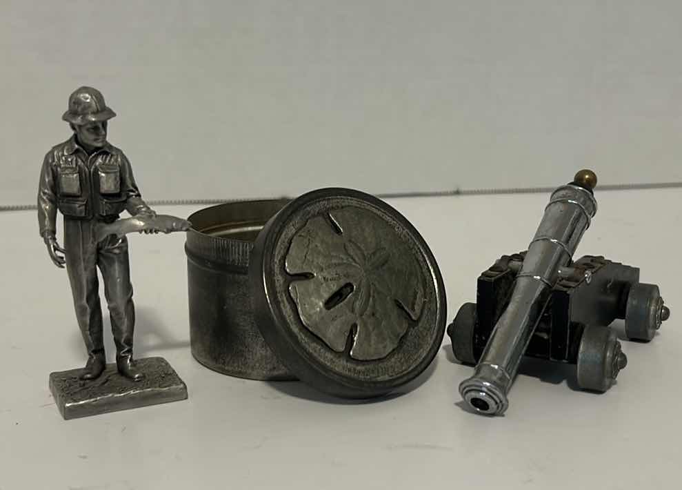 Photo 1 of METAL FIGURINES: SAND DOLLAR TIN, FISHERMAN, CANNON