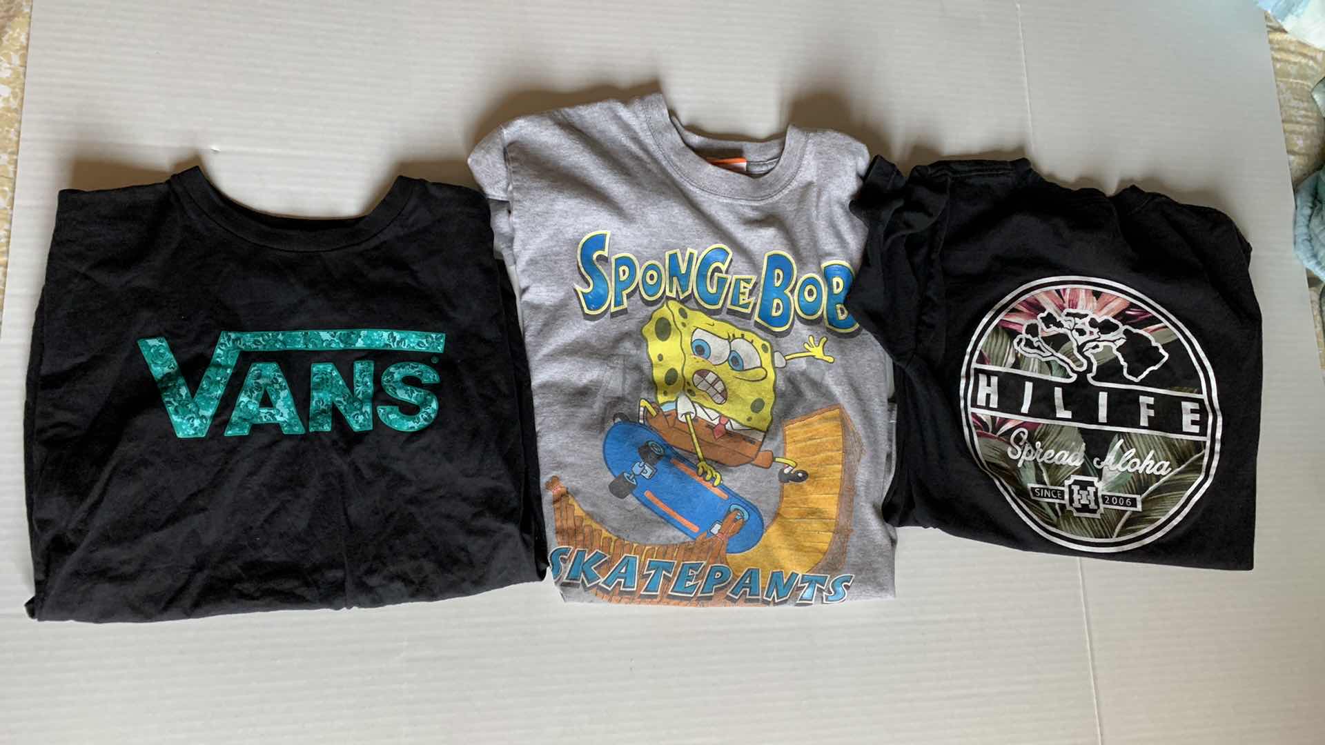 Photo 1 of THREE KIDS T-SHIRTS SIZE S AND M VANS