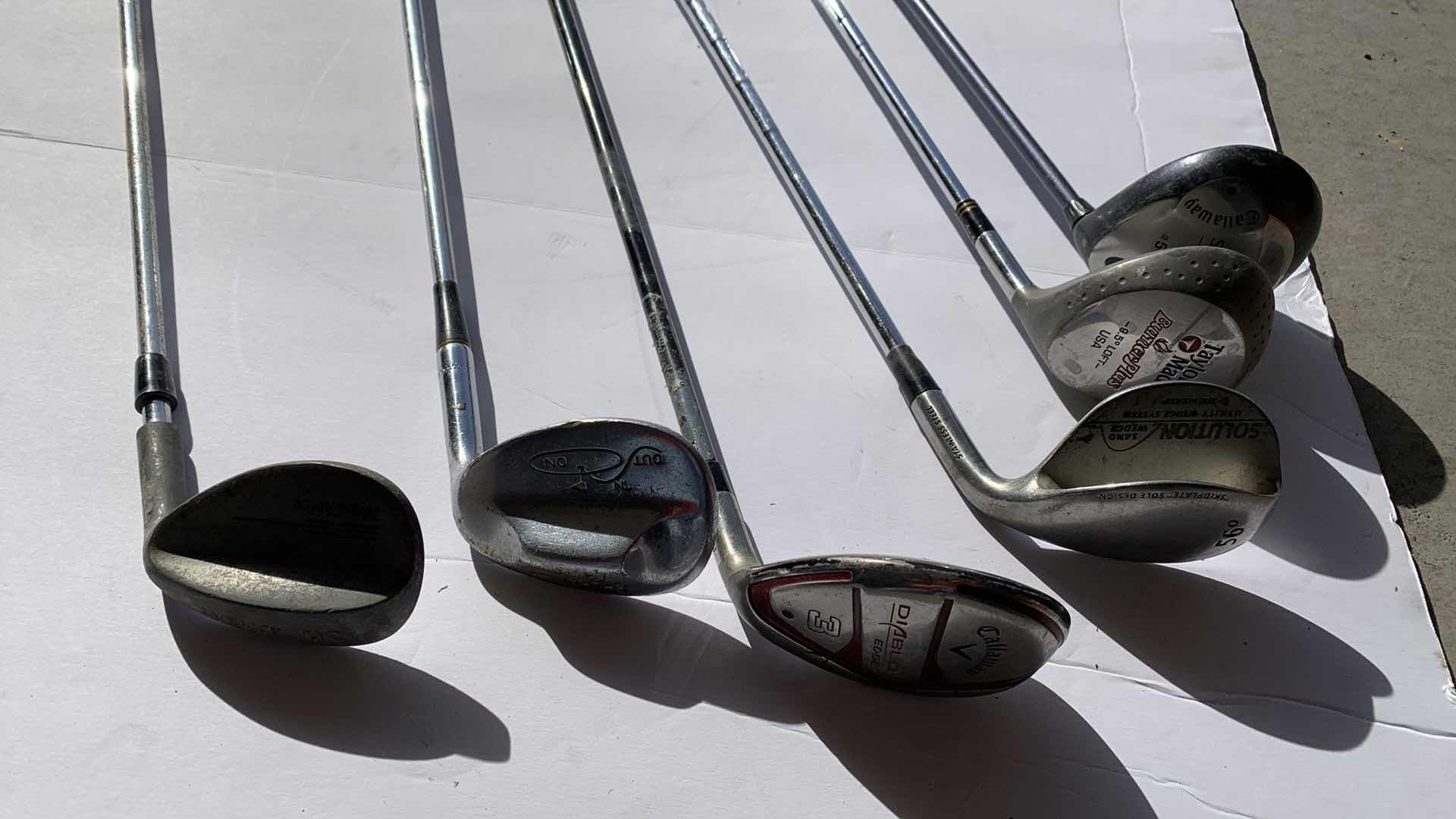 Photo 1 of ASSORTED GOLF CLUBS: CALLAWAY AND TAYLOR MADE