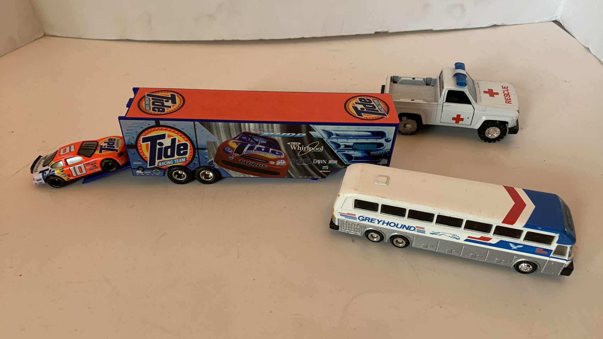 Photo 1 of NASCAR RICKY RUDD TRAILER AND CAR, GREYHOUND BUS, AND RESCUE JEEP