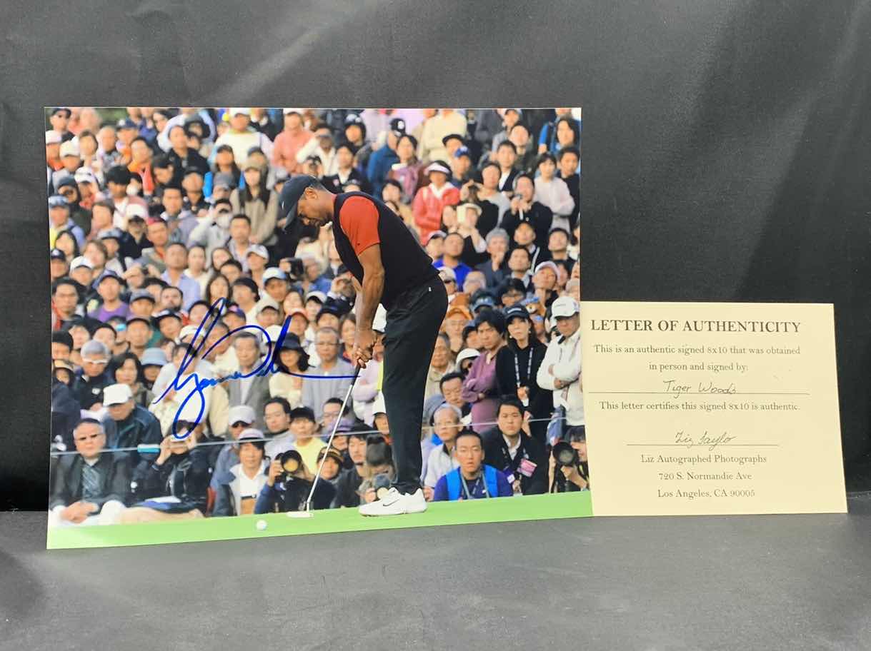 Photo 1 of TIGER WOODS  - SIGNED AUTOGRAPHED PHOTO W LETTER OF AUTHENTICITY 8” X 10”