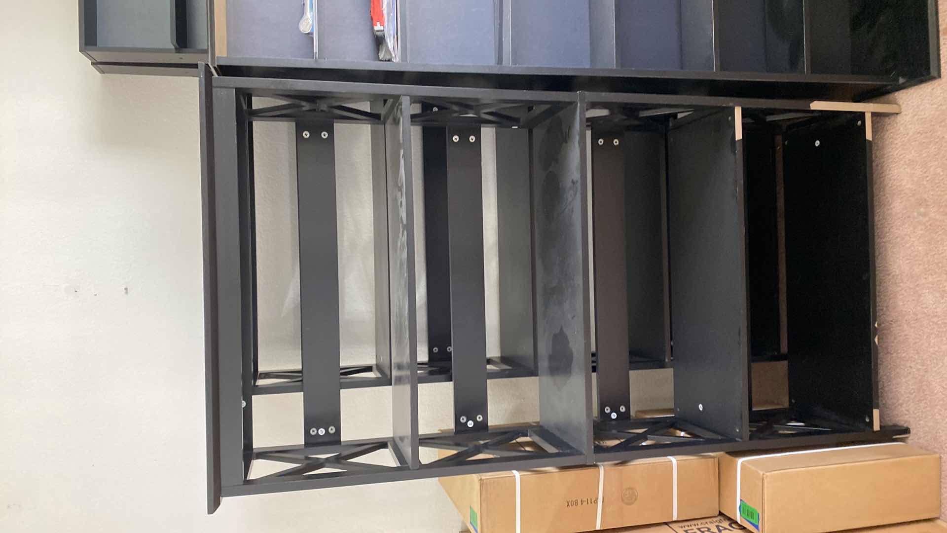 Photo 1 of PAIR OF BLACK PARTICLE BOARD BOOK SHELVES 32“ x 11“ H 59”
