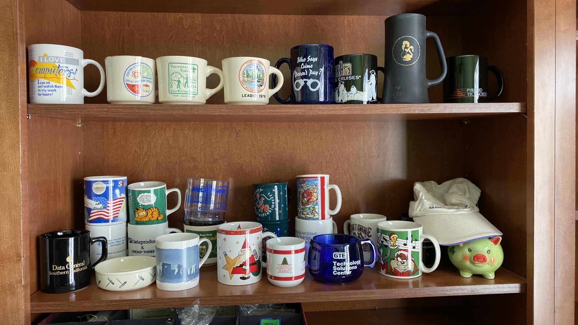Photo 1 of TWO SHELVES OF COLLECTABLE COFFEE CUPS