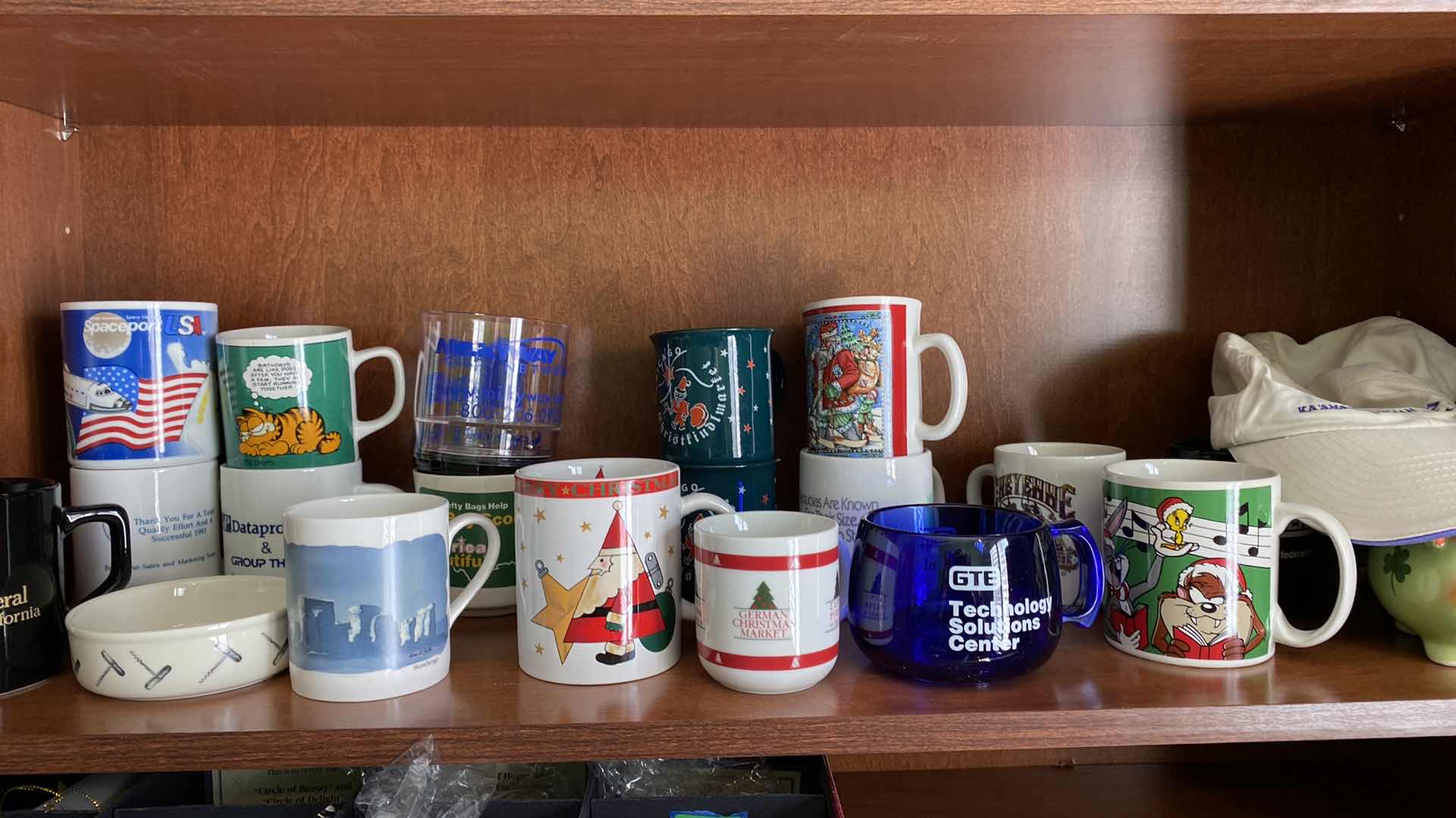Photo 2 of TWO SHELVES OF COLLECTABLE COFFEE CUPS