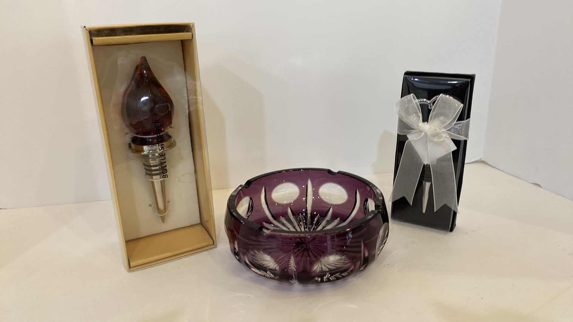 Photo 1 of PURPLE CRYSTAL ASHTRAY AND 2 BOTTLE STOPPERS