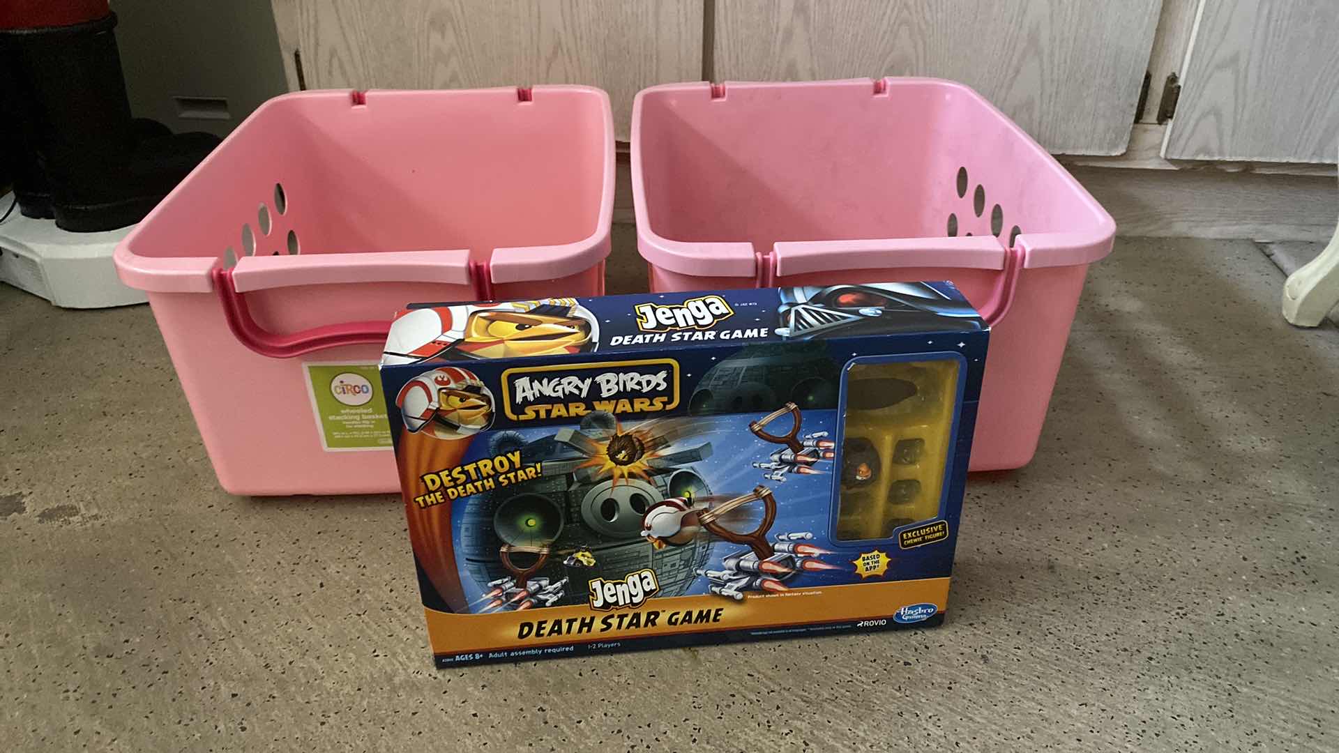 Photo 1 of PAIR OF PLASTIC PINK TOTES WITH WHEELS 20” x 16” H 10 1/2” AND ANGRY BIRDS GAME - UNKNOWN IF PIECES MISSING