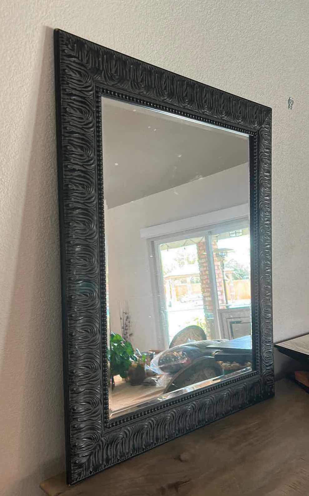 Photo 1 of BLACK FRAMED BEVELED GLASS MIRROR 
29 1/4” x 35 1/4”