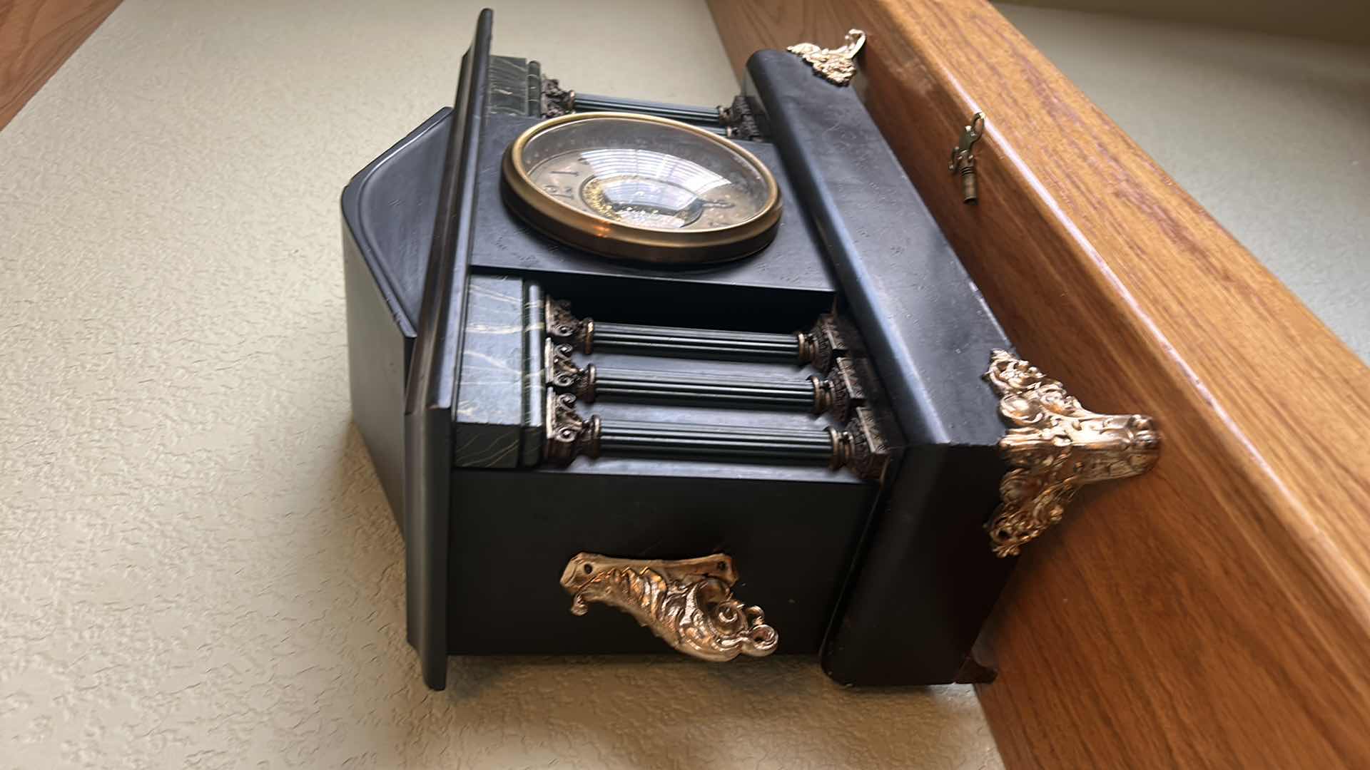 Photo 2 of VINTAGE MANTLE CLOCK WITH KEY 
17” x 12 1/2”