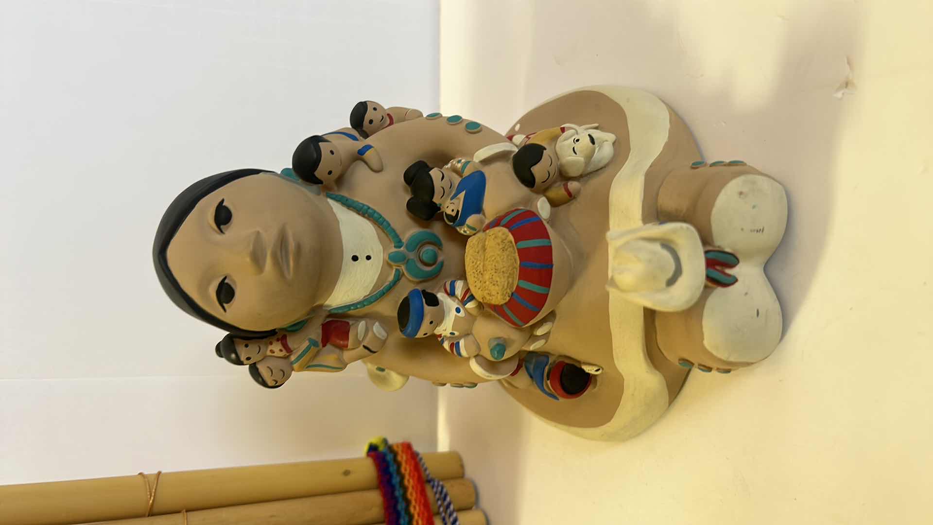 Photo 2 of SIGNED INDIAN FIGURINE AND PERUVIAN FLUTE