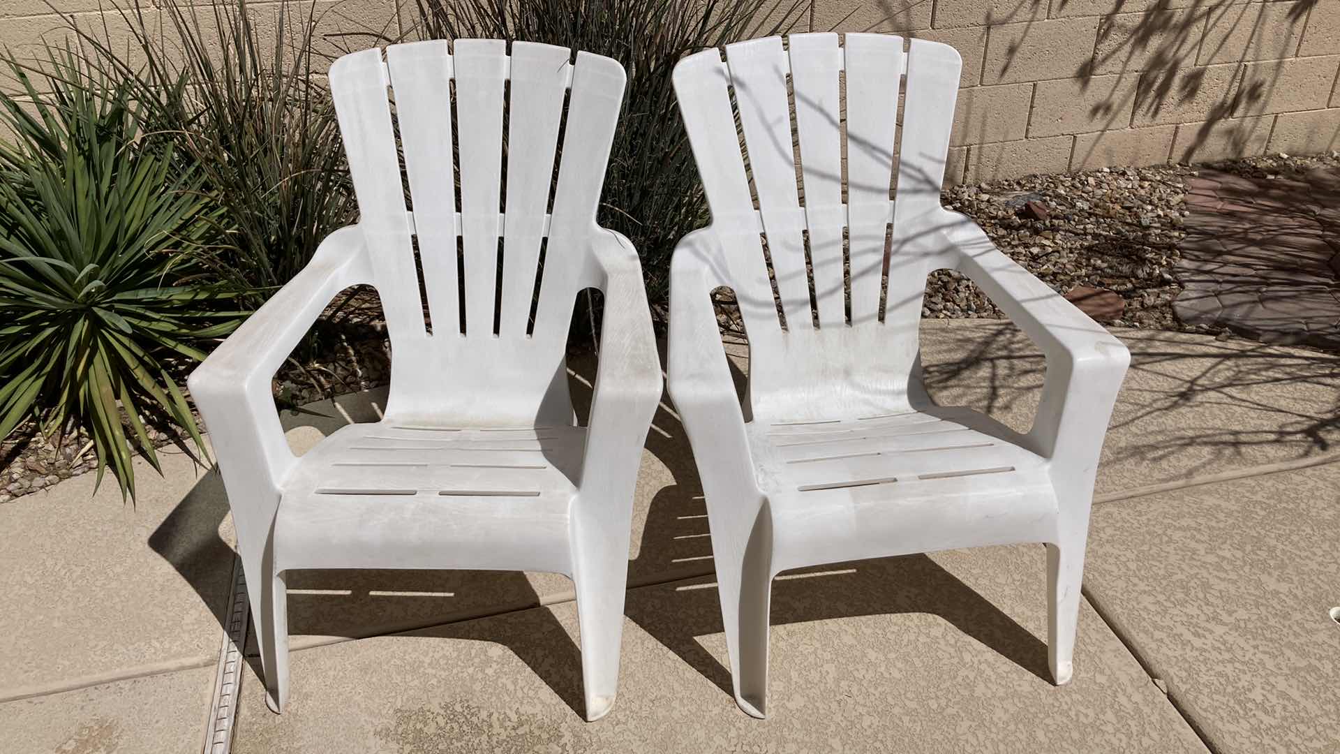 Photo 1 of OUTDOOR PATIO PLASTIC CHAIRS (2) 30.5” X 29” H35.5”