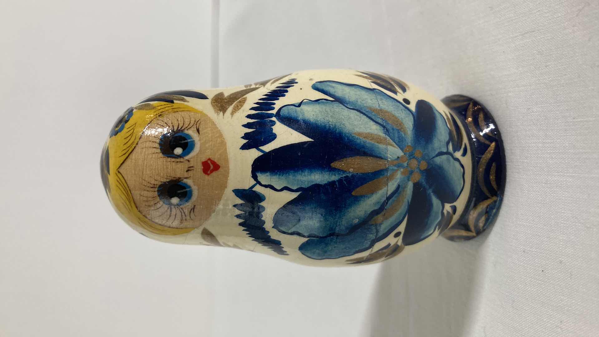 Photo 1 of HAND PAINTED NESTING DOLL H3.5