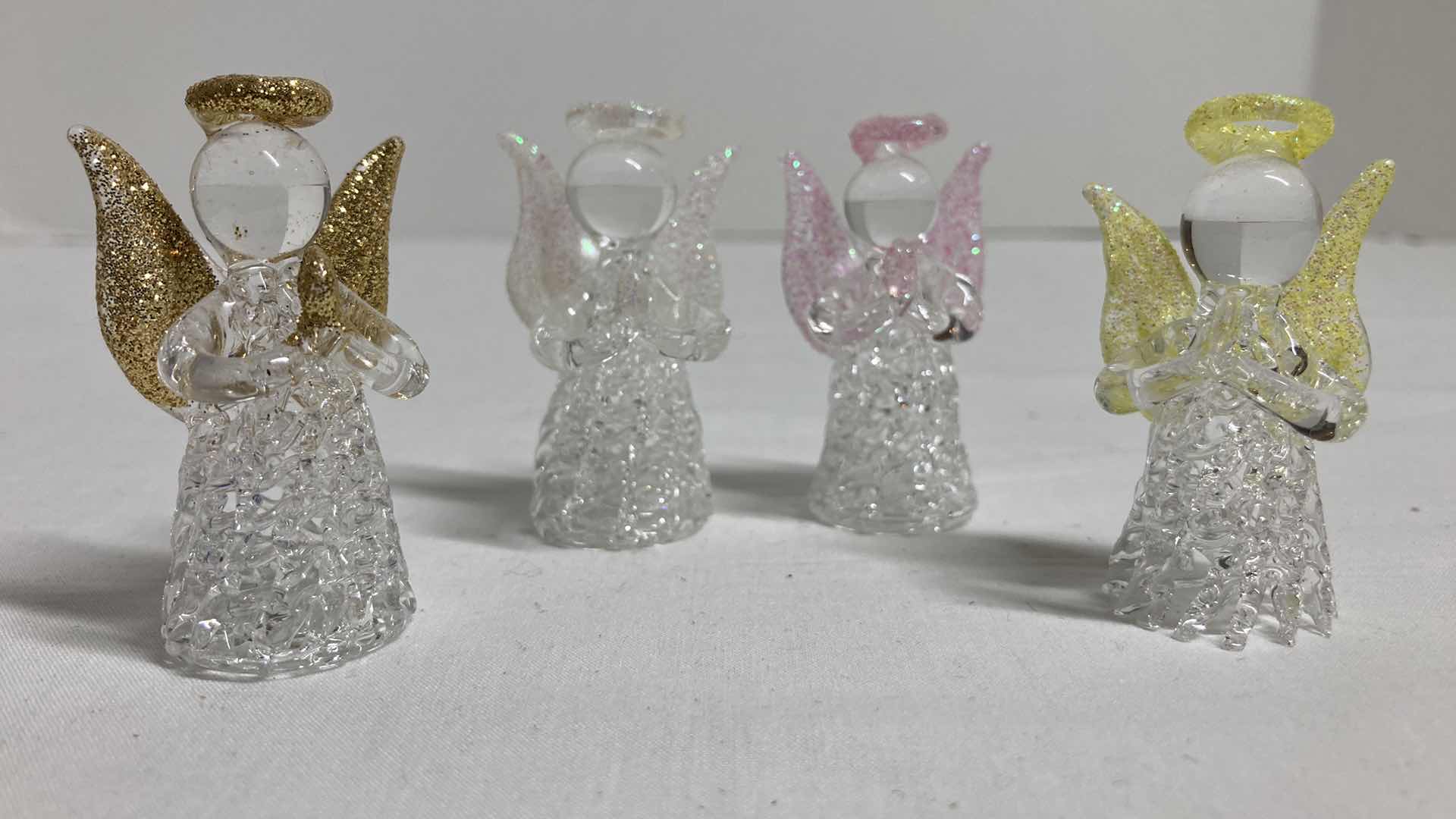 Photo 1 of GLASS ANGEL FIGURINES (4) H2”