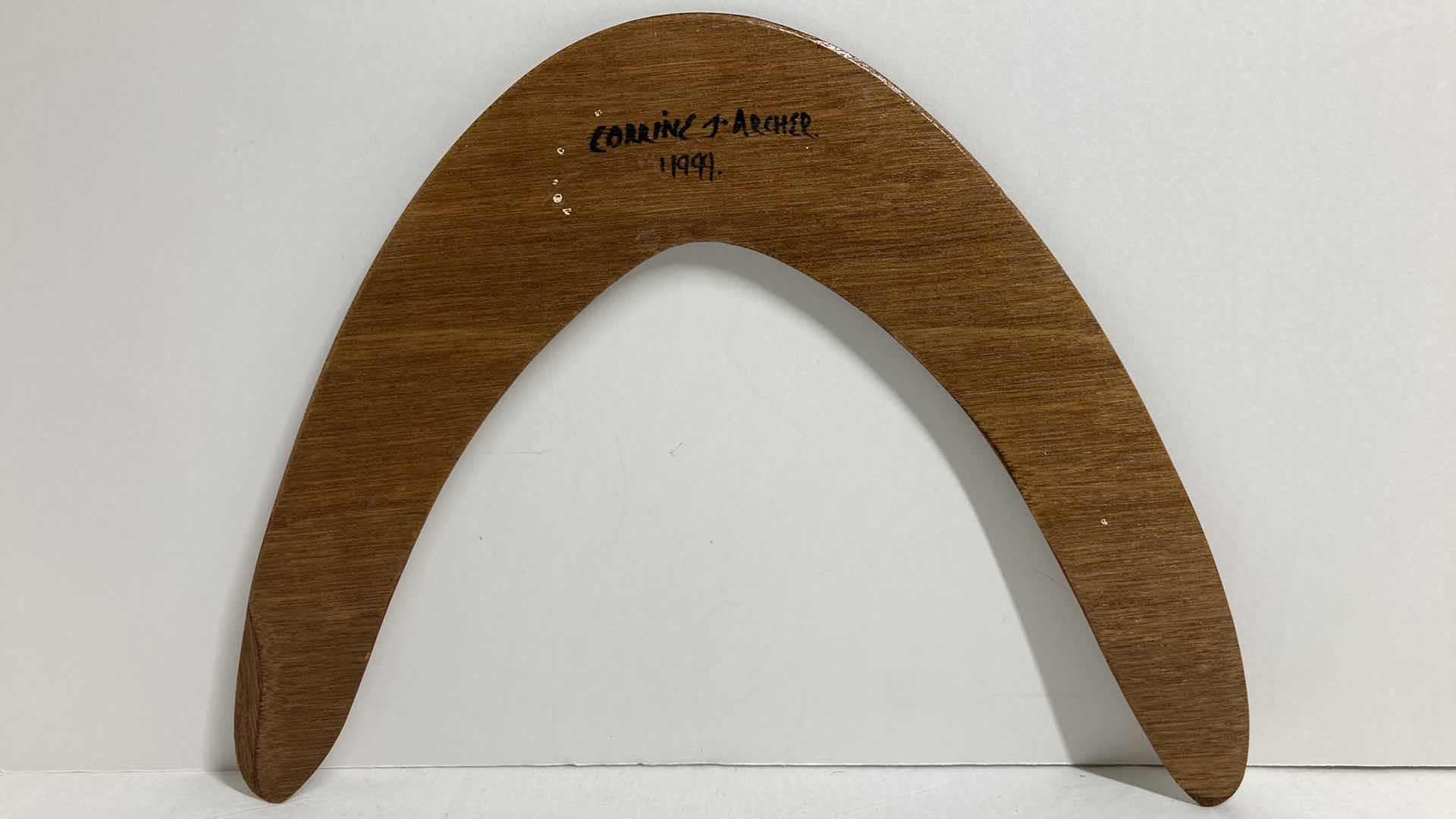 Photo 2 of WOODEN HAND PAINTED BOOMERANG BY CORRINE J. ARCHER 1999 12.75” X 9.75”