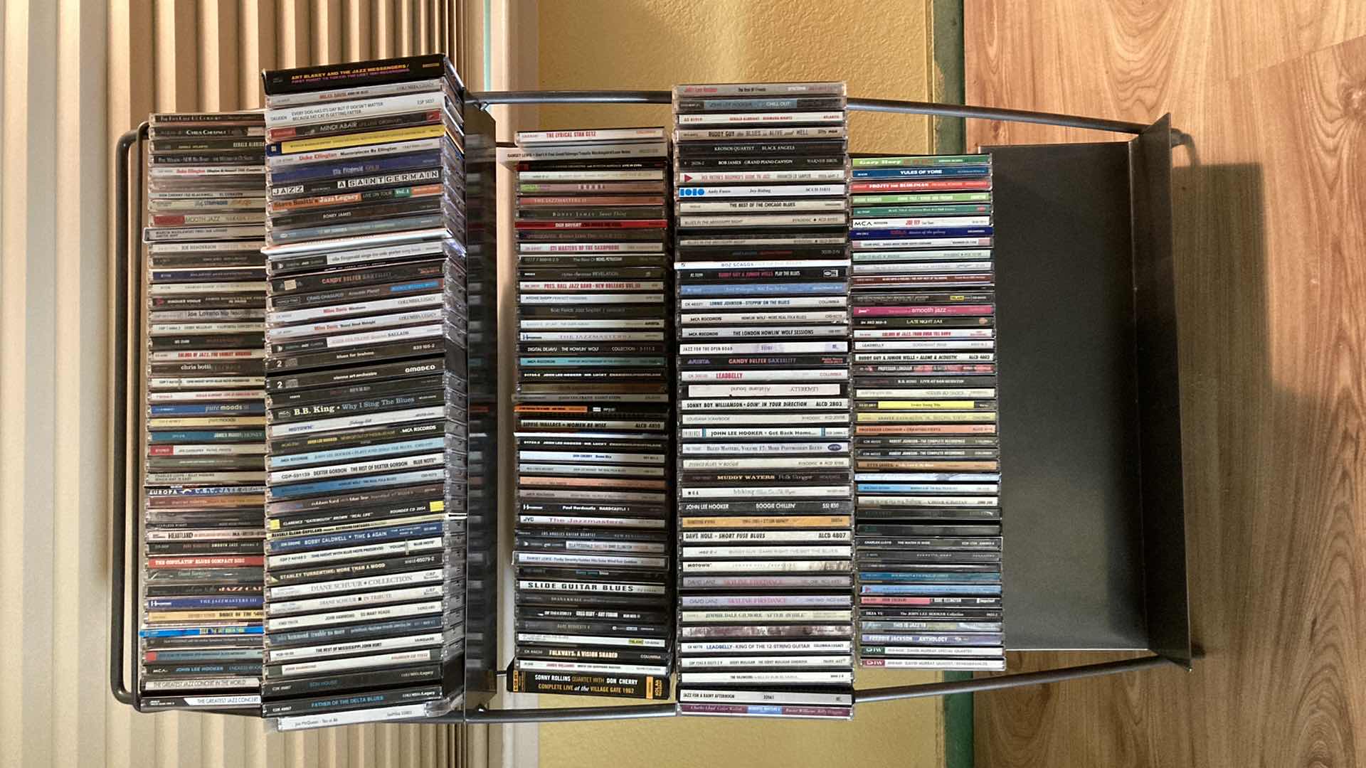 Photo 1 of JAZZ & BLUES MUSIC CD’S (APPROX 200) W METAL RACK 19.25” X 13.25” H35.5”