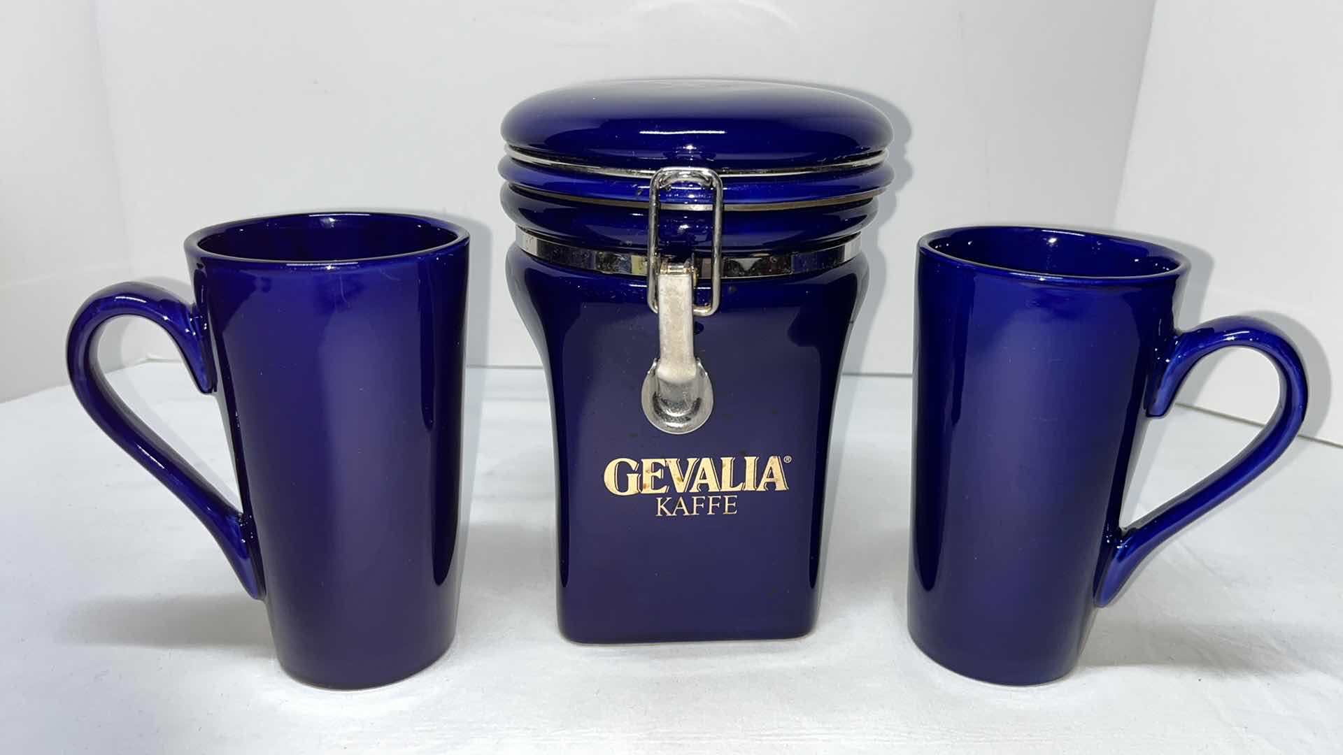 Photo 1 of GEVALIA KAFFE CERAMIC 7.75” FLIP TOP CANISTER W 2 COBALT BLUE 6” COFFEE CUPS