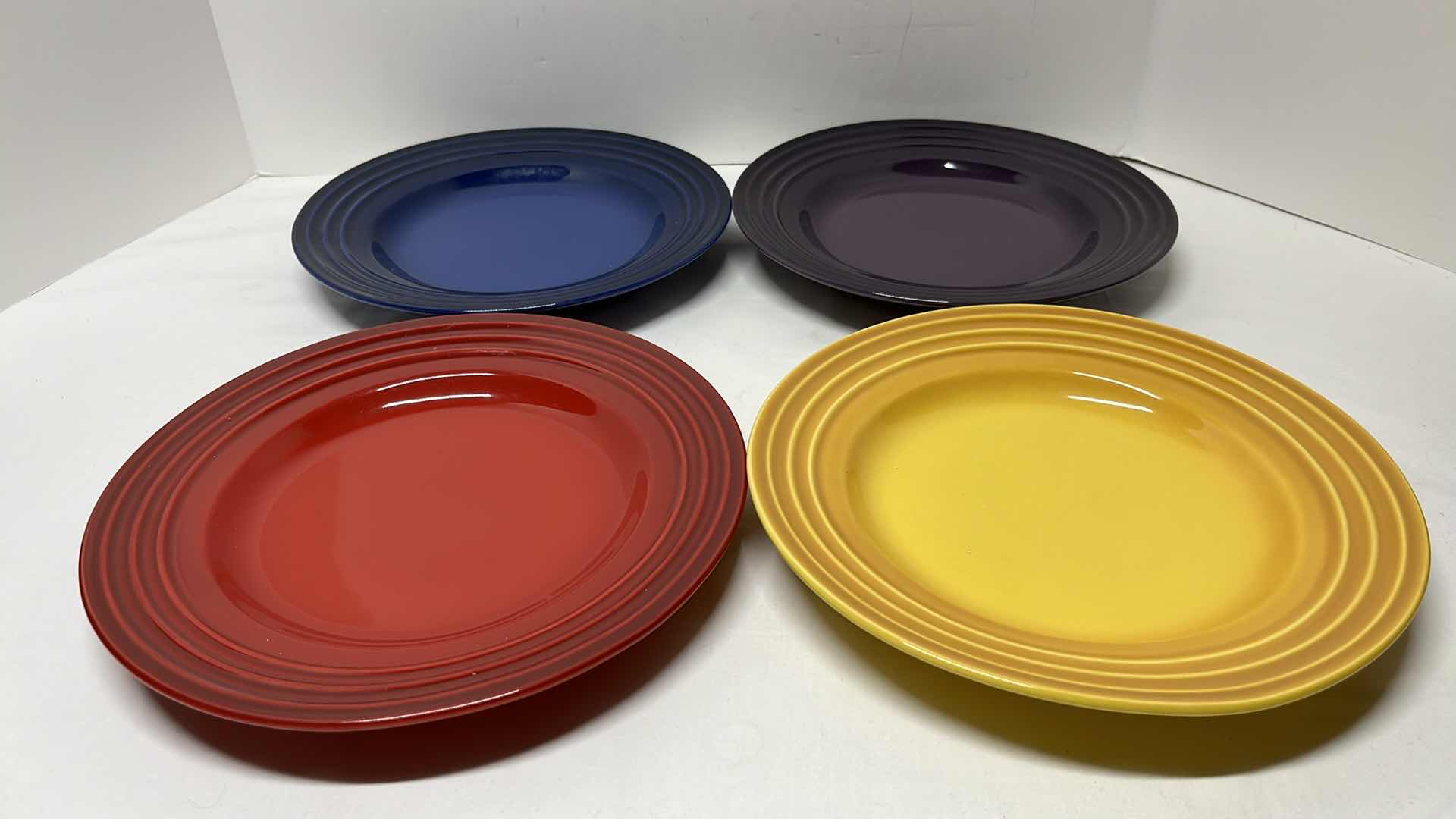 Photo 1 of LE CREUSET STONEWARE SET OF 4 DINNER PLATES, 10”