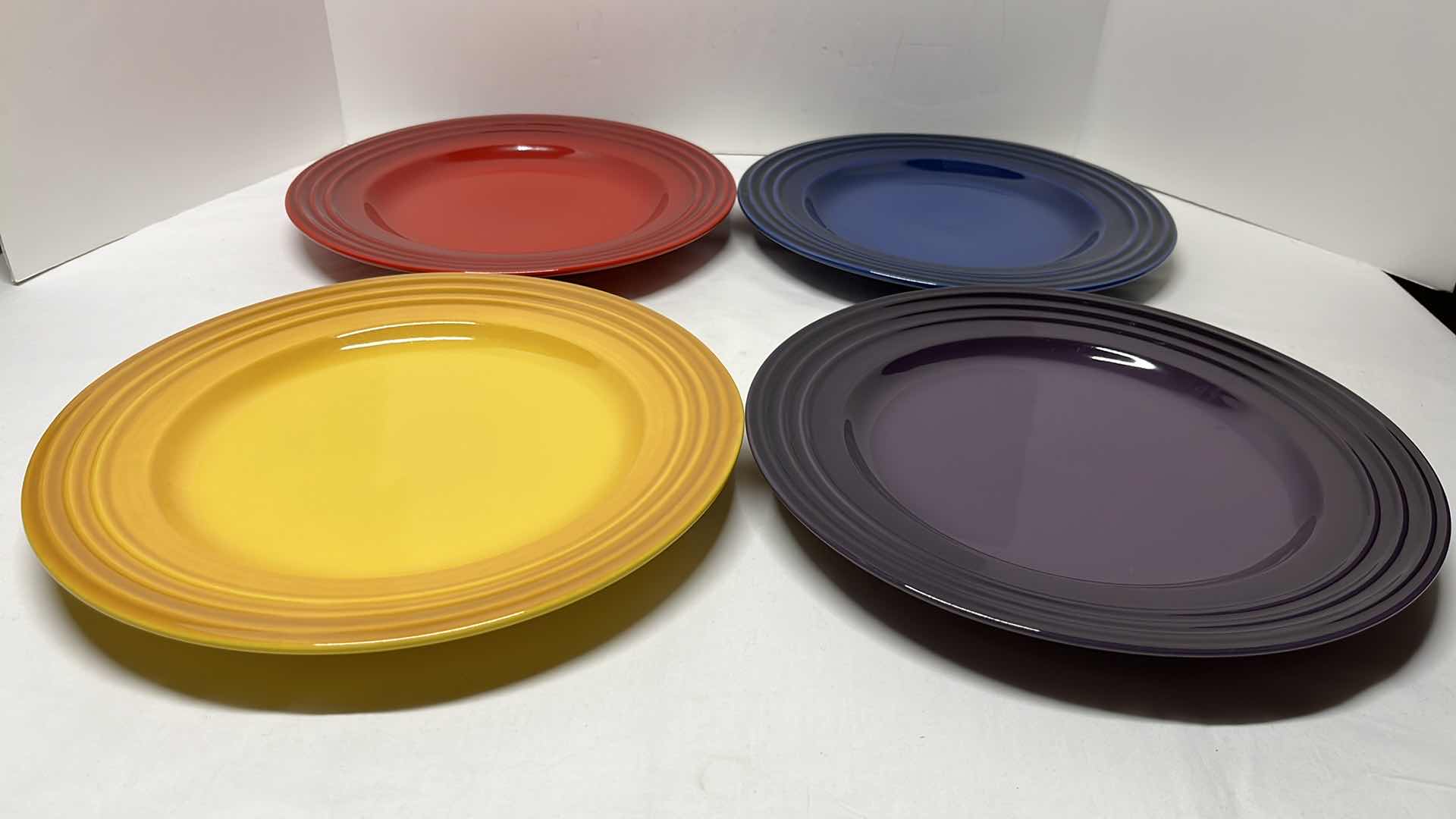 Photo 1 of LE CREUSET STONEWARE SET OF 4 DINNER PLATES, 12”