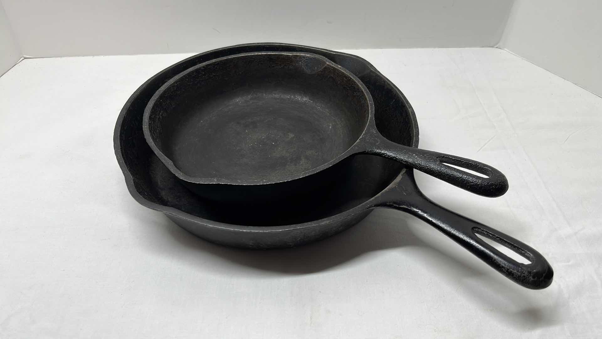 Photo 1 of 2 PCS CAST IRON SKILLETS 8.25” & 10.5”