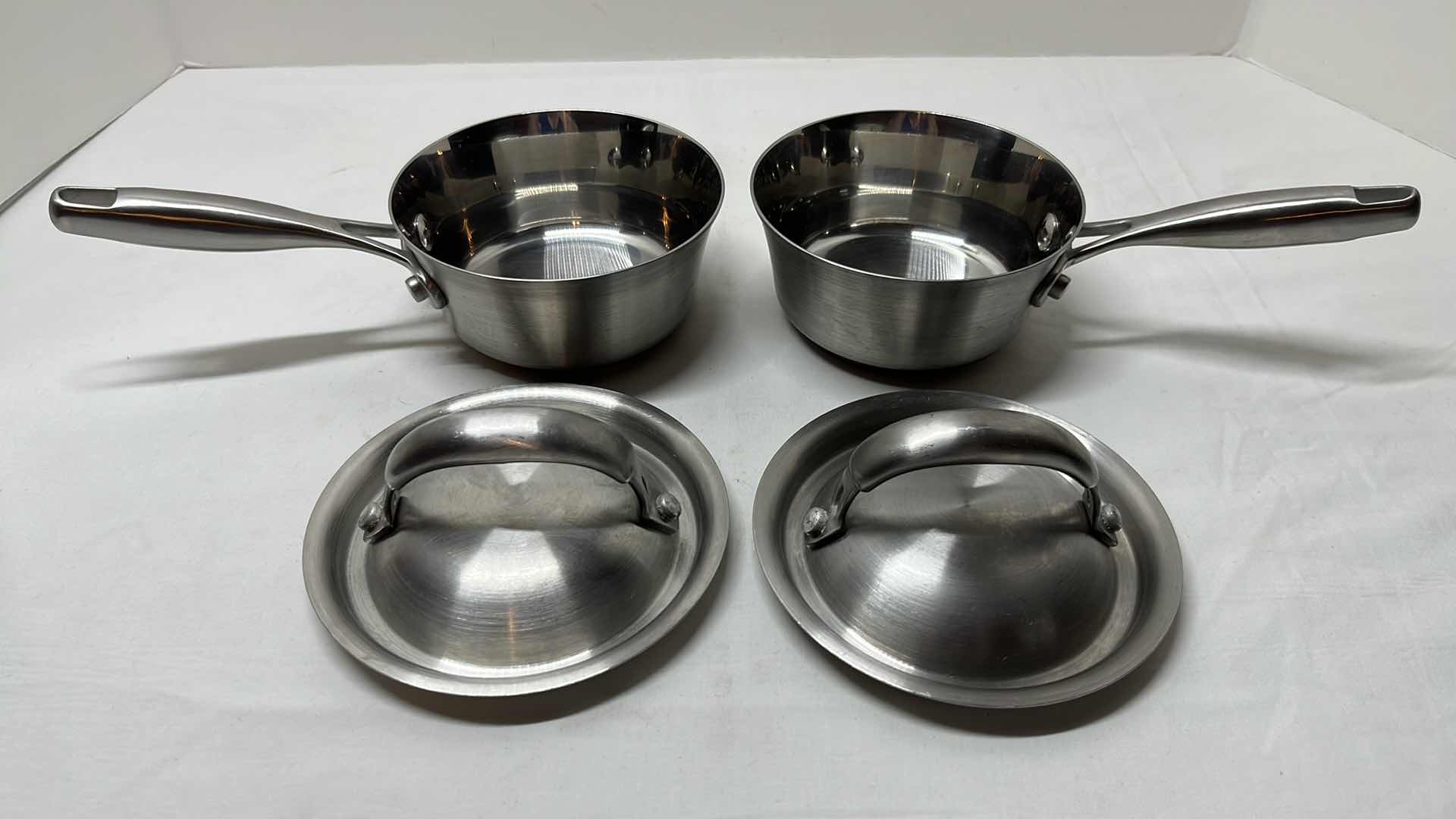 Photo 3 of TECHNIQUE STAINLESS STEEL .5 QT POTS W LIDS (2) & ALL-CLAD 2.5 QT STAINLESS STEEL REDUCTION POT W NO LID