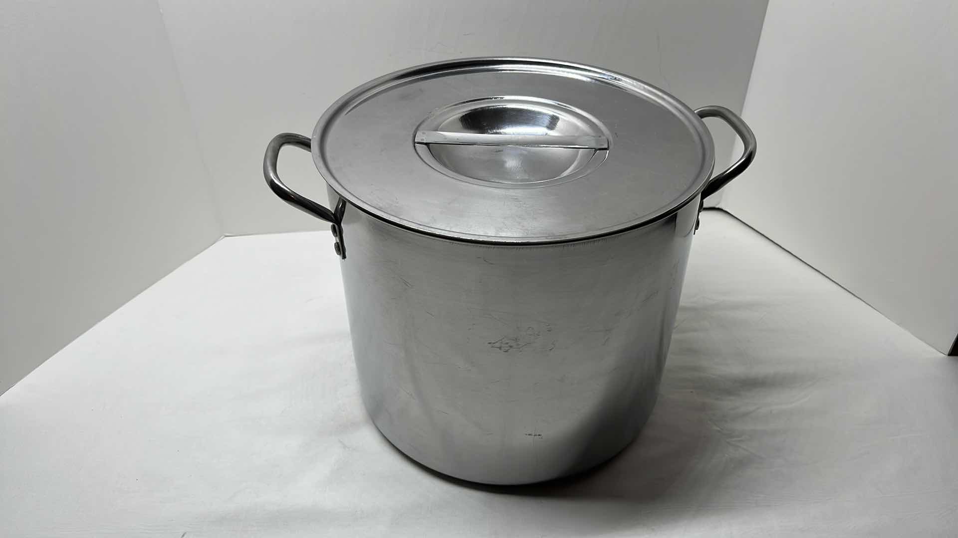 Photo 1 of STAINLESS STEEL COVERED STOCK POT 11” X 9.75”H