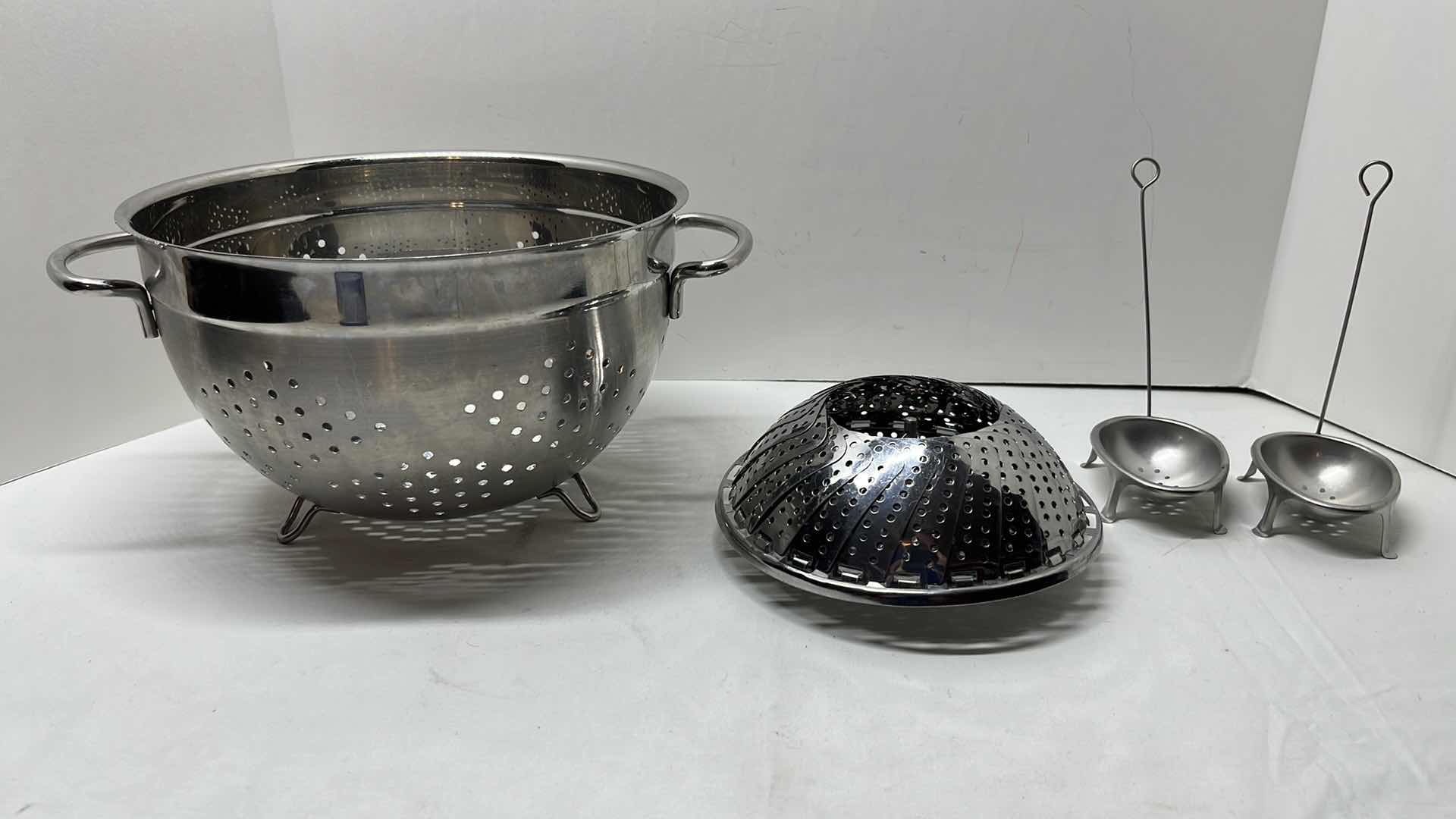 Photo 1 of STAINLESS STEEL COLANDER 9.5” X 6”H, 2- FRENCH TIN EGG POACHERS & STAINLESS STEEL STEAMER BASKET 5.75”