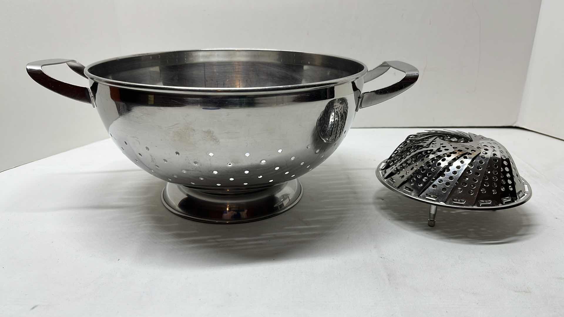 Photo 1 of SHARDA STAINLESS STEEL COLANDER W HANDLES 10” X 5.25”H & STAINLESS STEEL STEAMER BASKET  4.75”