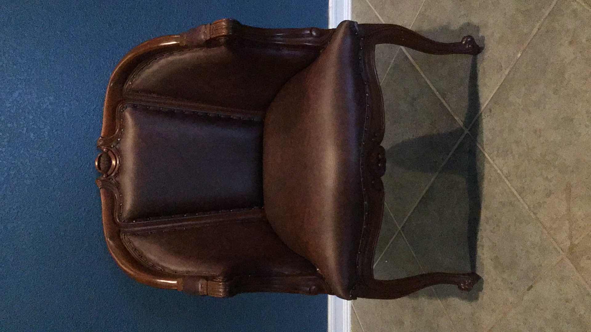 Photo 1 of CARVED WOOD AND LEATHER ARMCHAIR 29” X 28 H39”