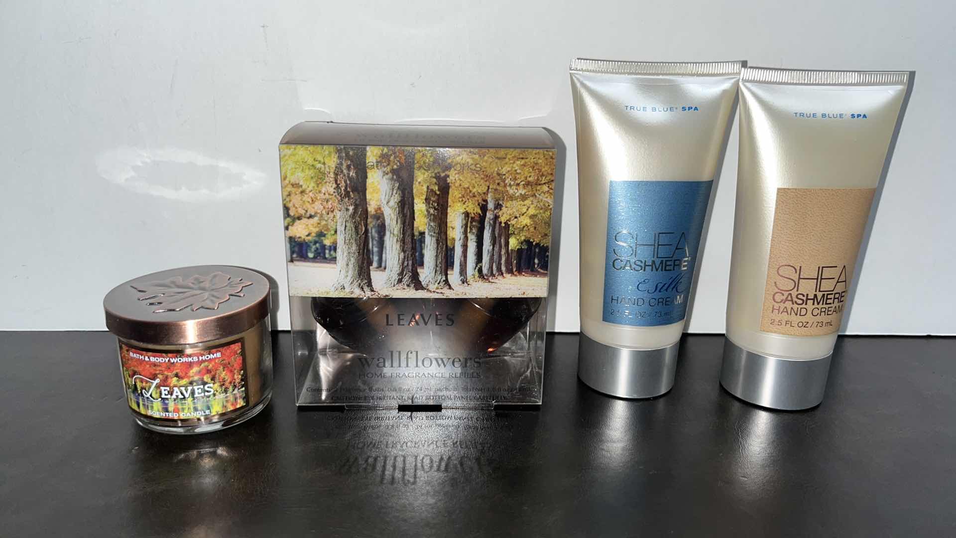 Photo 1 of NEW BATH & BODY WORKS LEAVES 1.3oz SCENTED CANDLE, LEAVES WALLFLOWERS HOME FRAGRANCE REFILL 2-PACK, SHEA CASHMERE 2.5oz HAND CREAM (2)