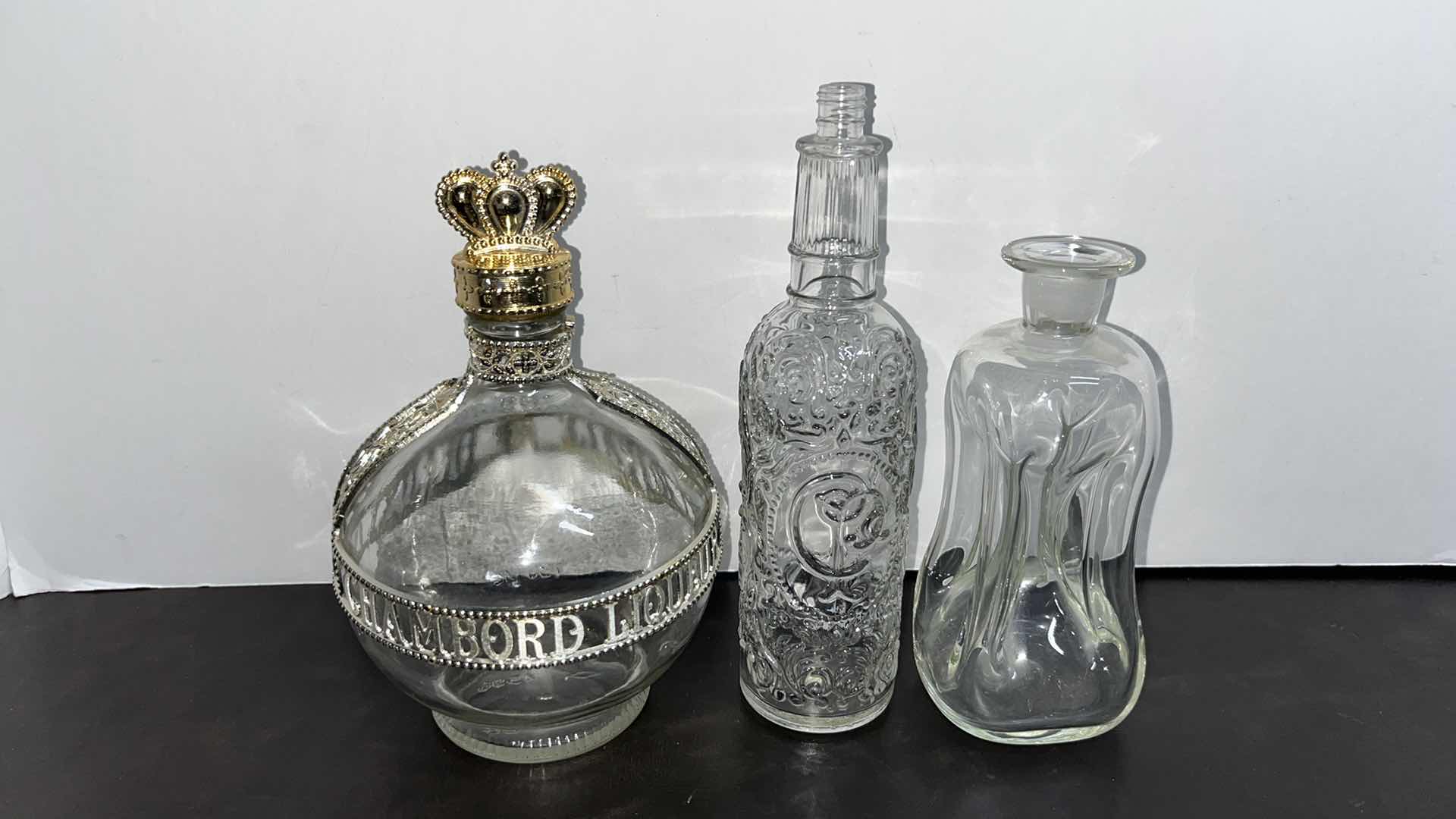 Photo 1 of VINTAGE CLEAR GLASS BOTTLES (3)