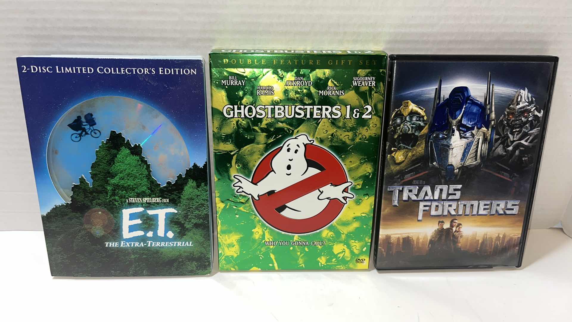 Photo 1 of STEVEN SPIELBERGS E.T. 2-DISC DVD LIMITED COLLECTORS EDITION, GHOSTBUSTERS 1 & 2, TRANSFORMERS DVD (3)