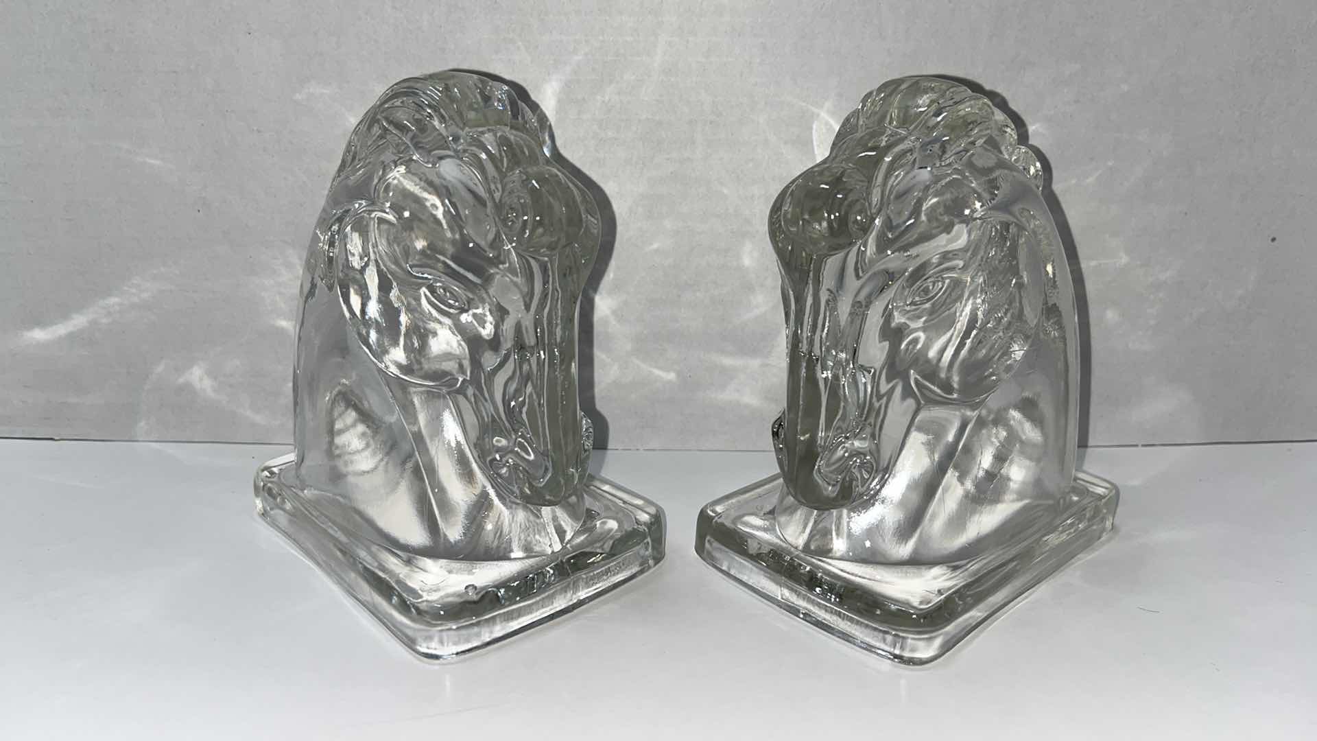 Photo 2 of VINTAGE MIDCENTURY CLEAR GLASS HORSE HEAD BOOKENDS, 3.25” X 4.75” H5.5” (2)