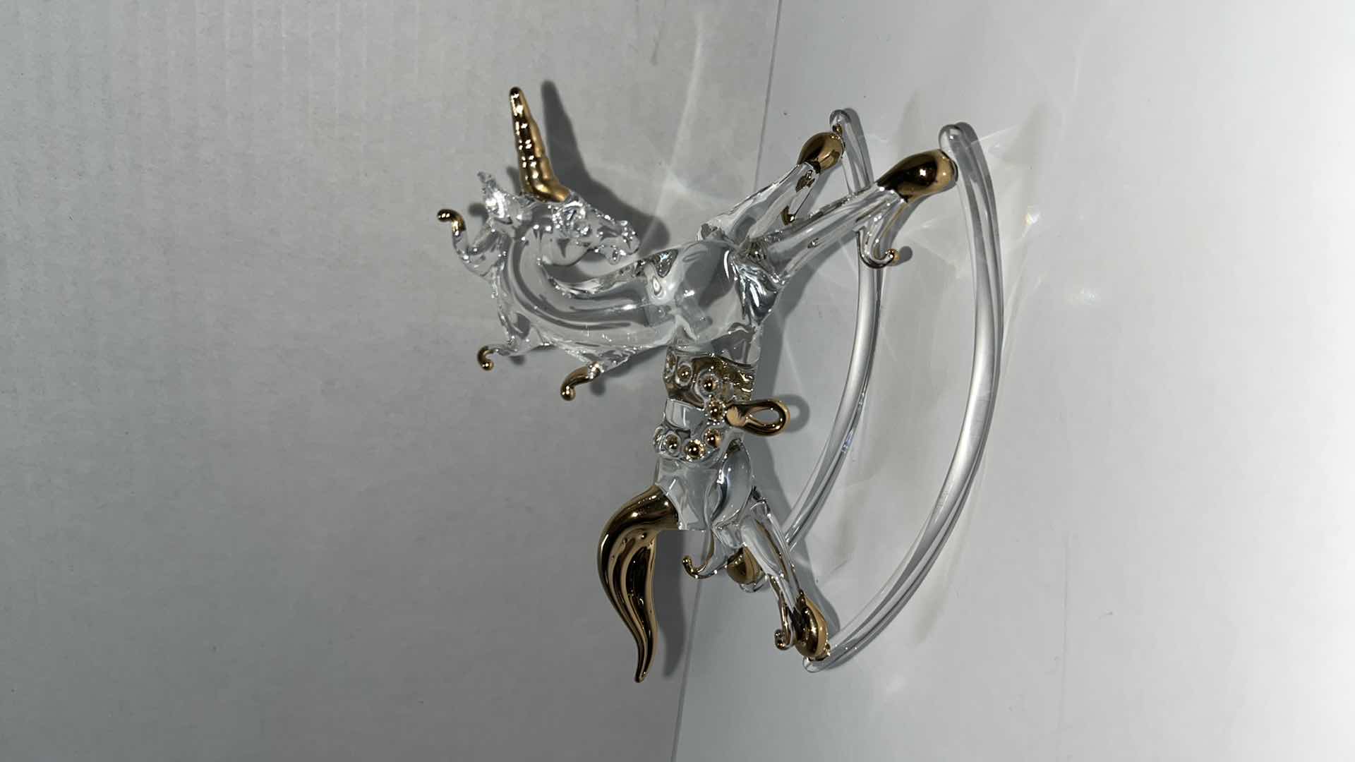 Photo 2 of HAND BLOWN CLEAR GLASS ROCKING UNICORN W GOLD ACCENTS 4.75” X 2” H4”W CRYSTAL ROCKING HORSE W GOLD ACCENTS (2)