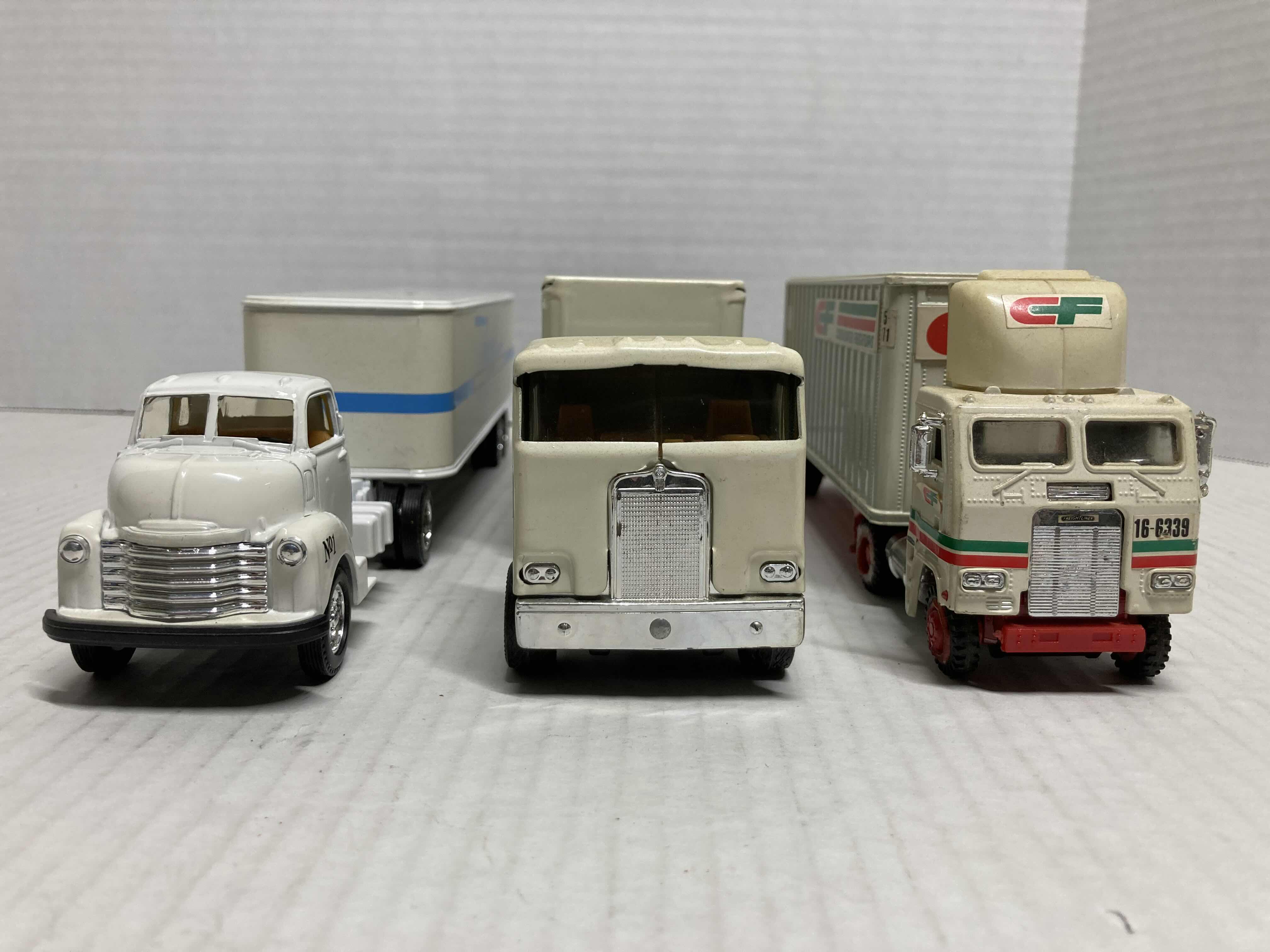 Photo 2 of ERTL AUTO LITERATURE & DOW BRANDS SEMI-TRUCKS W 
TONKIN CF CONSOLIDATED FREIGHTWAYS SEMI-TRUCK MODEL TRUCKS