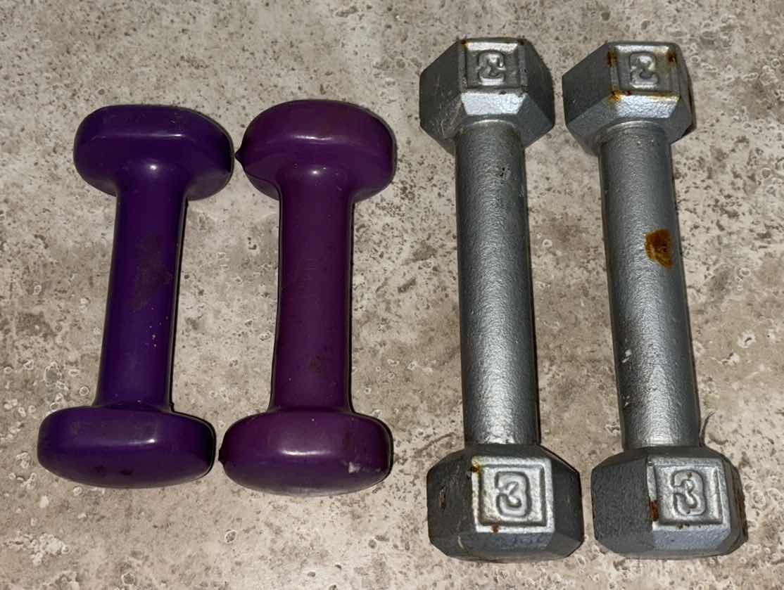 Photo 1 of DUMBBELL SETS, PURPLE 2LBS & CAST IRON 3LBS