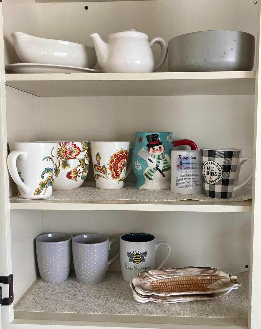 Photo 1 of CONTENTS OF CABINET- MUGS & SERVING DISHES