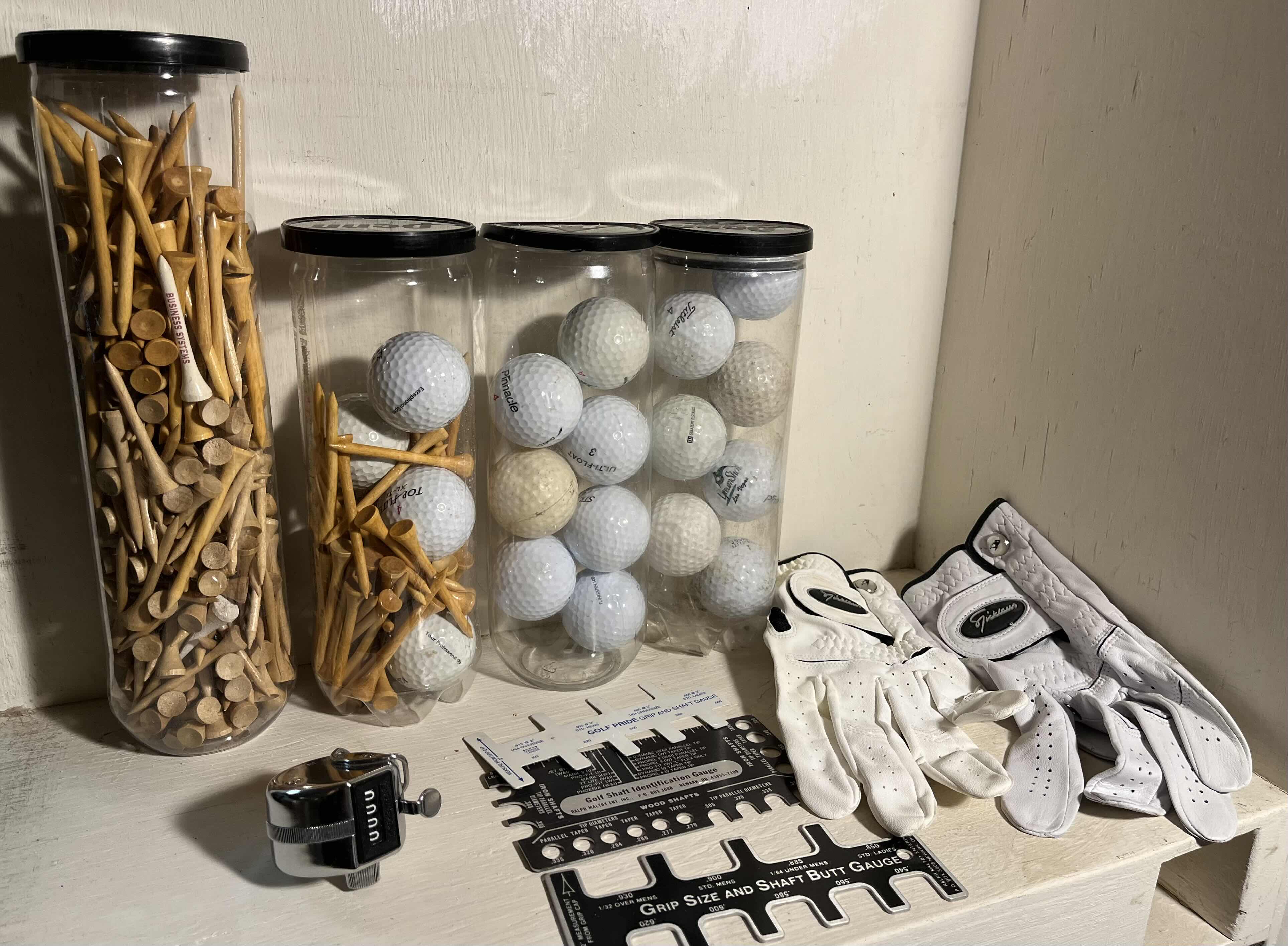 Photo 1 of GOLF ACCESSORIES-WOOD TEES, GOLF BALLS, COUNTER, GAUGES & GLOVES