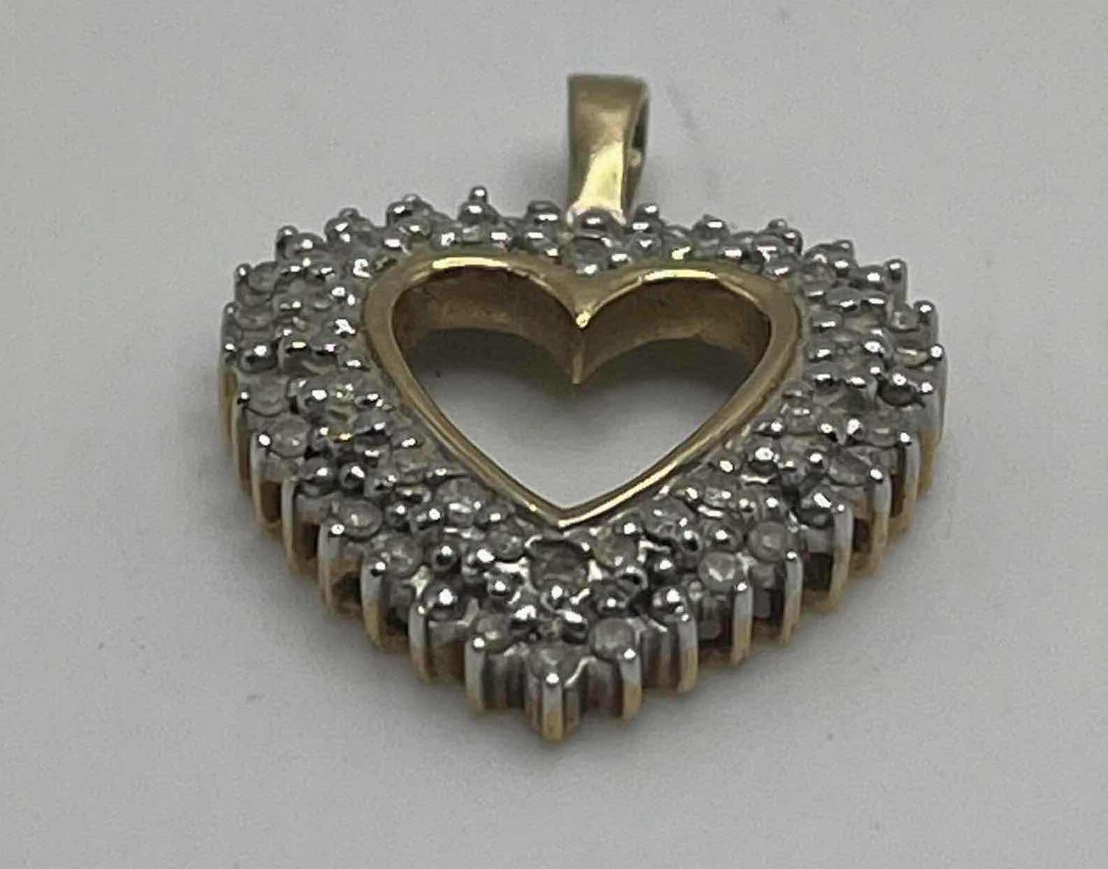 Photo 2 of DIAMOND CLUSTER GOLD 10K HEART PENDANT 3GRAMS