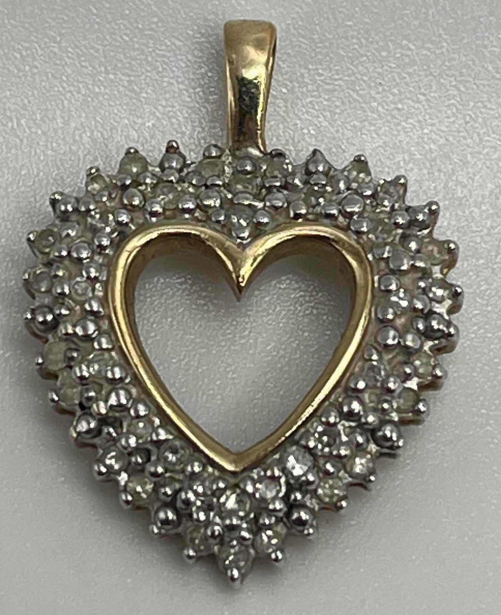 Photo 1 of DIAMOND CLUSTER GOLD 10K HEART PENDANT 3GRAMS