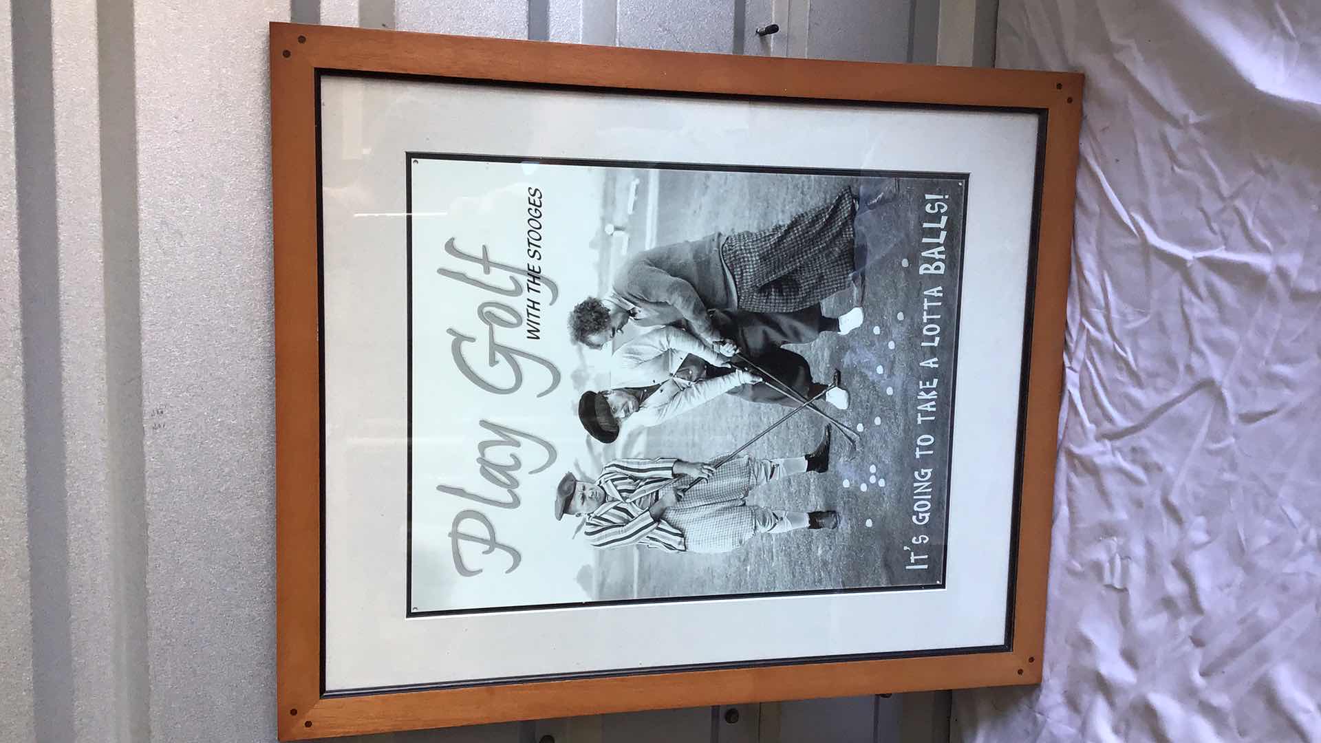 Photo 4 of ASSORTED WALL DECO - OAK POSTER FRAME 28” X 22”, 3 STOOGES GOLF POSTER FRAMED 22” X 18”, HOME SWEET HOME SIGN 42” X 11”