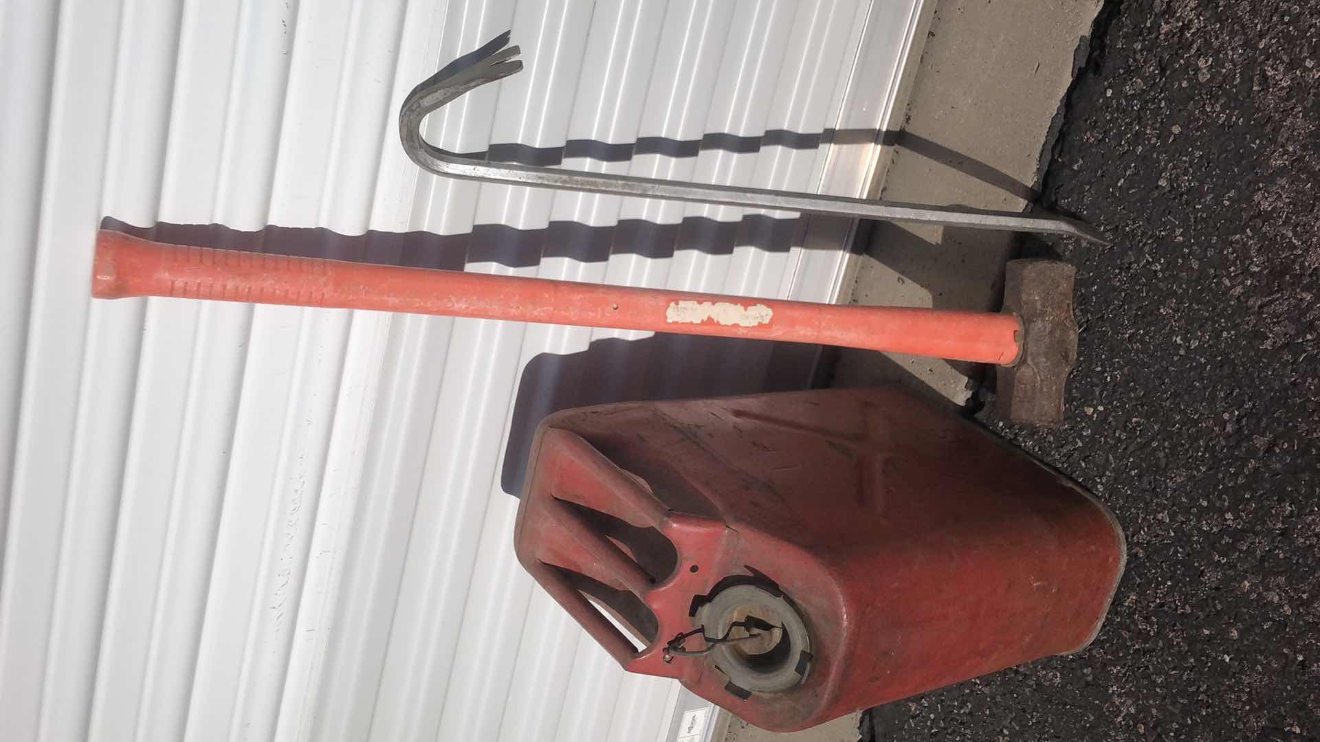 Photo 1 of HALF FULL STEEL FUEL CAN (CONTENTS UNKNOWN), CROWBAR AND SLEDGEHAMMER