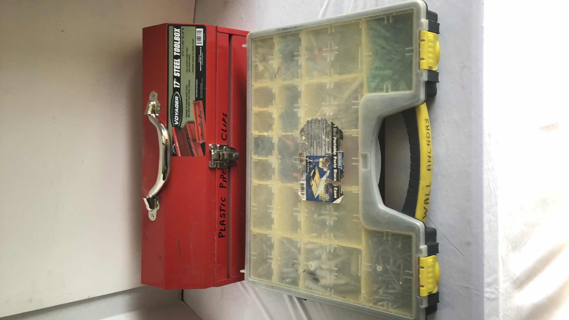 Photo 1 of VOYAGER 17” STEEL TOOLBOX W CRIMPING TOOLS AND STOREHOUSE STORAGE BIN FULL OF WALL ANCHORS