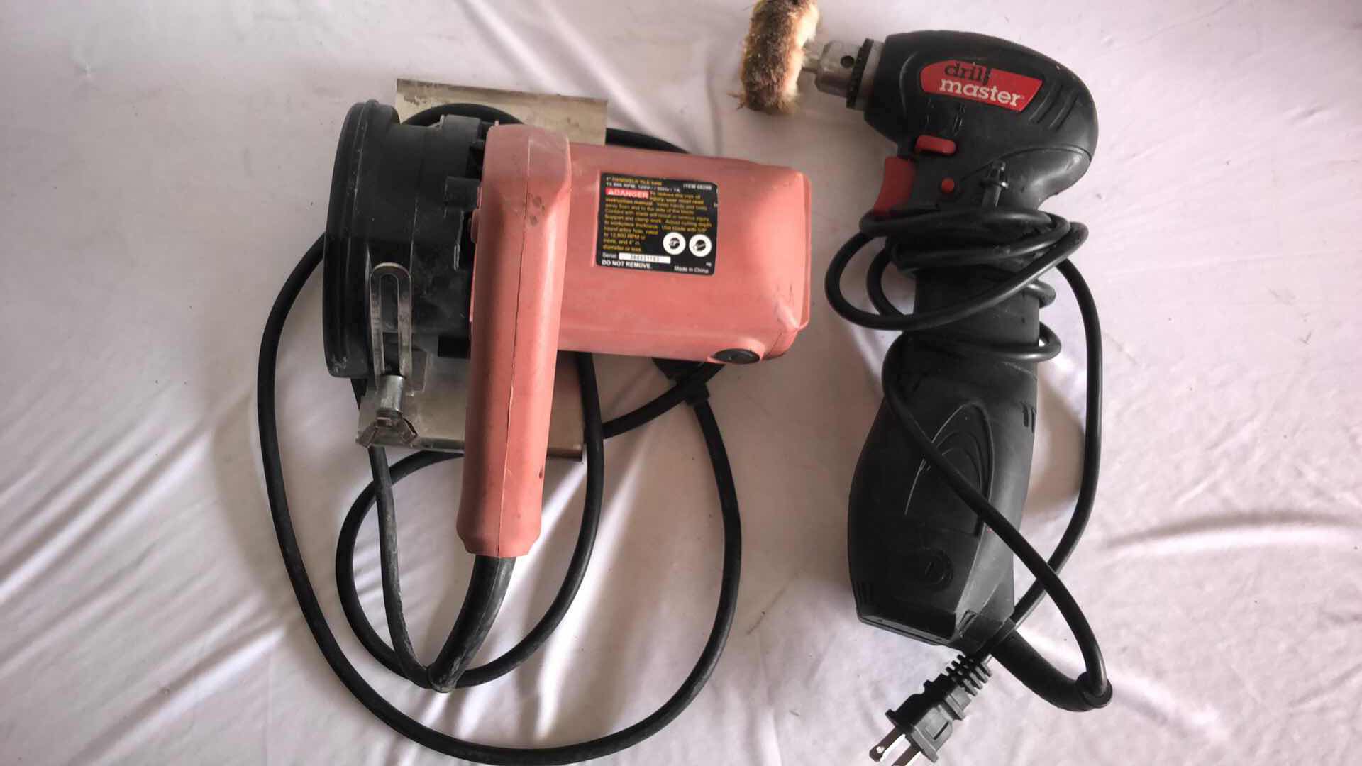 Photo 1 of DRILL MASTER CLOSE QUARTER DRILL AND CHICAGO ELECTRIC 4” HANDHELD TILE SAW (2)
