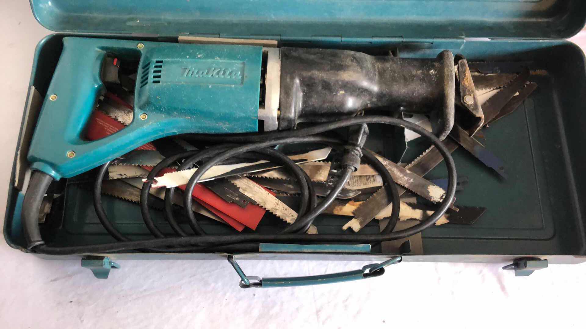 Photo 2 of MAKITA SAW ZAW WITH METAL CASE AND BLADES