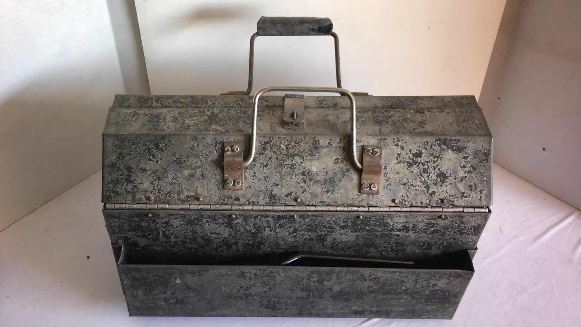 Photo 1 of LARGE METAL TOOL BOX WITH ASSORTED TOOLS AND PITTSBURGH ELECTRIC CARPET STRETCHER