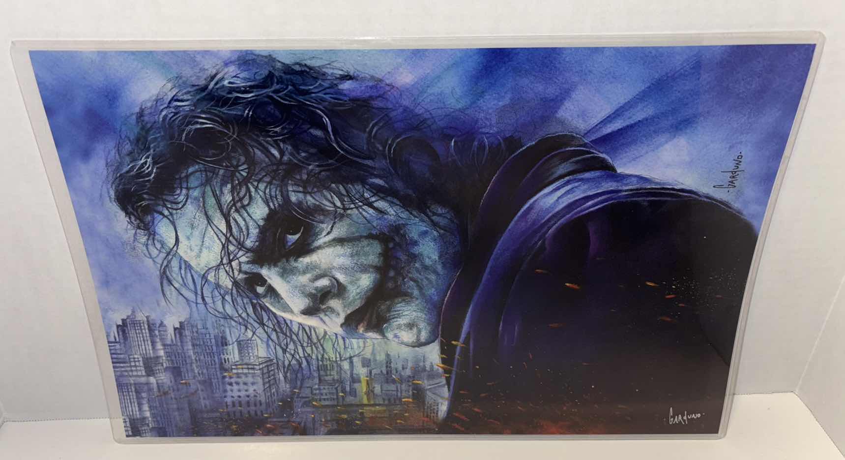 Photo 1 of VICTOR GARDUNO “WHY SO SERIOUS” 11” x 17” INFINITY GLOSS UNFRAMED PRINT W EMBOSSED SEAL, DIGITAL SIGNATURE & OFFICIAL SIGNATURE W COA INCLUDED, STORED IN A RIGID PRINT PROTECTOR SLEEVE