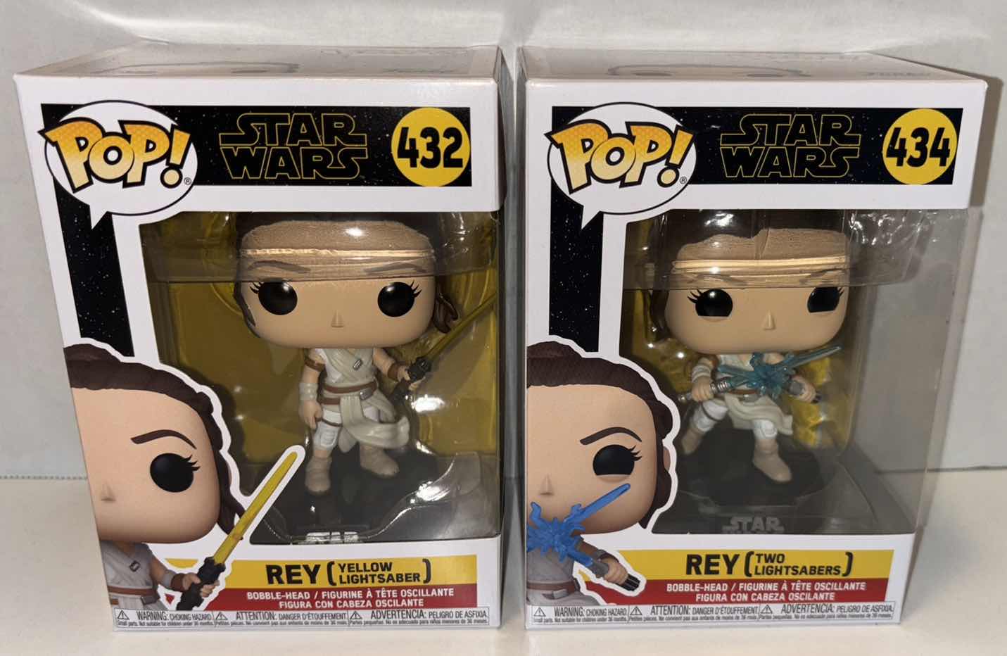 Photo 1 of NEW FUNKO POP! 2-PACK STAR WARS BOBBLE-HEAD VINYL FIGURES, #432 “REY (YELLOW LIGHTSABER) & #434 REY (TWO LIGHTSABERS)”