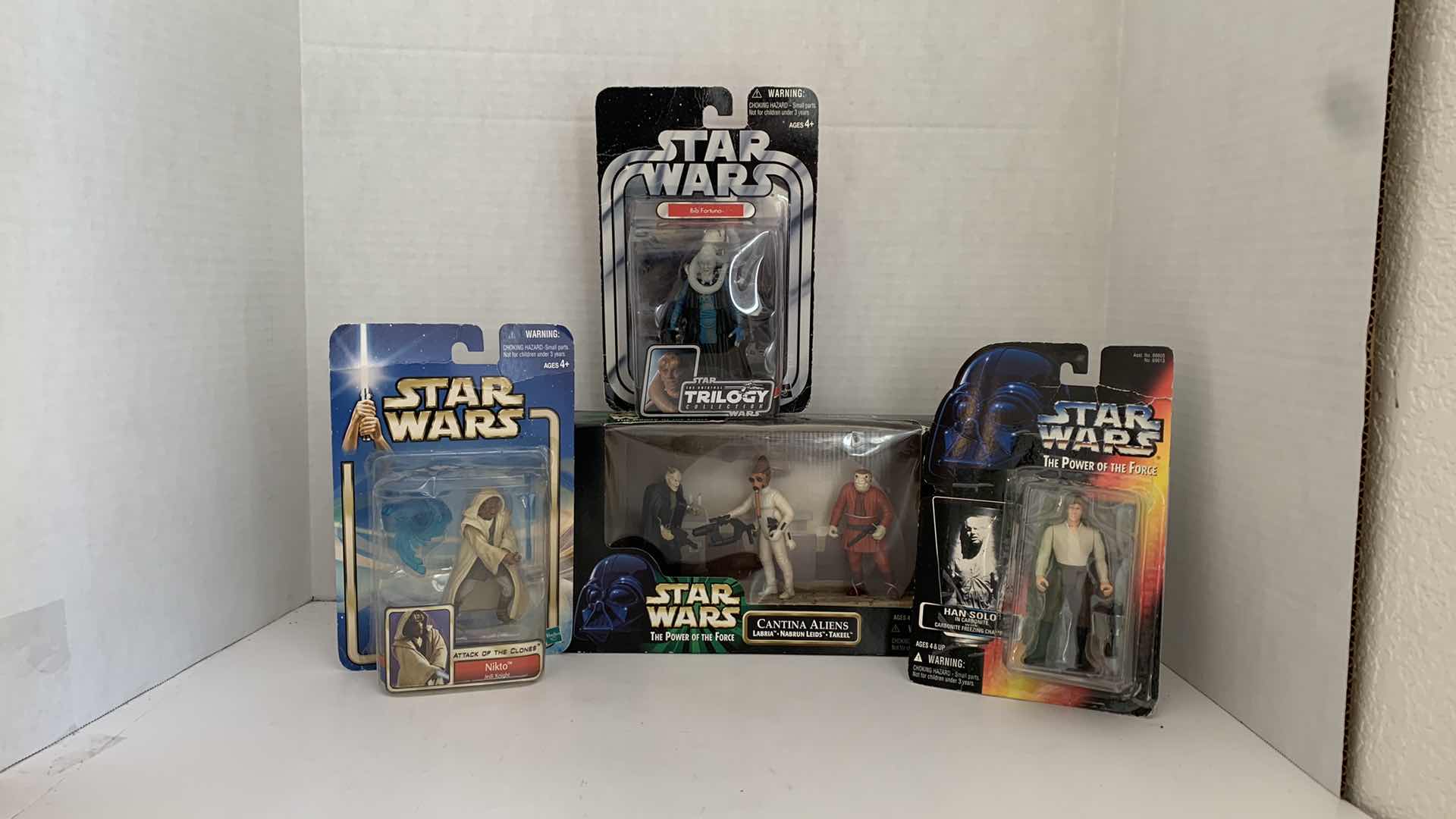 Photo 1 of SET OF 4 STAR WARS FIGURES IN BOX