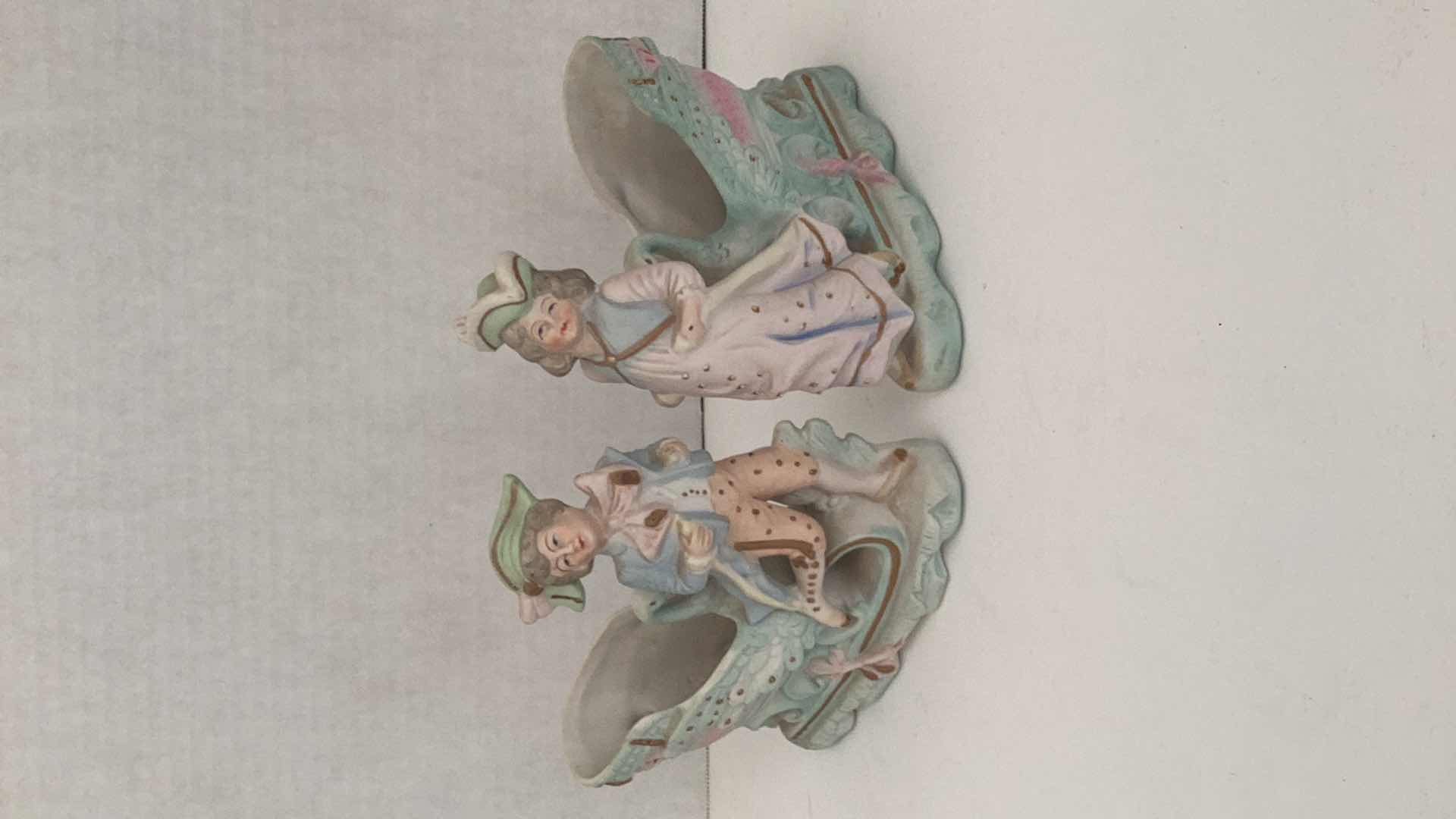 Photo 1 of VINTAGE PAIR OF “ PAULUX” MALE AND FEMALE CHARACTERS WITH SWAN CARRIAGE MADE IN OCCUPIED JAPAN 7” X 7” TALL
