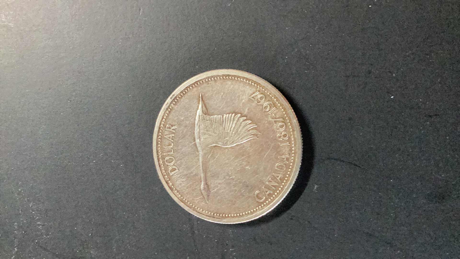 Photo 2 of CANADIAN 1867-1967 ONE DOLLAR COIN