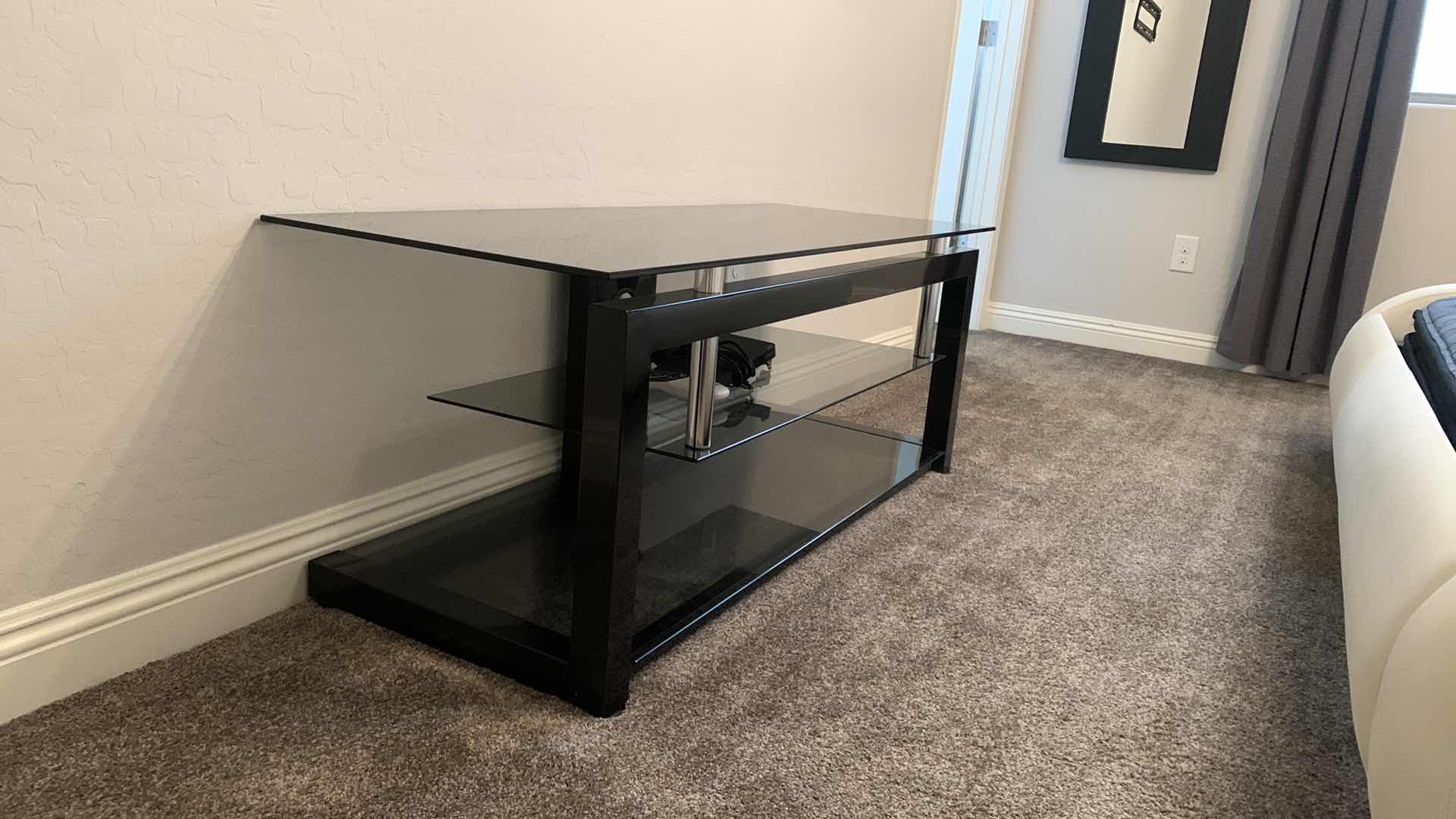 Photo 2 of BLACK SMOKED GLASS W CHROME ENTERTAINMENT CONSOLE (ELECTRONICS AND SOUND SYSTEMS NOT INCLUDED) 52” x 20” x H20”